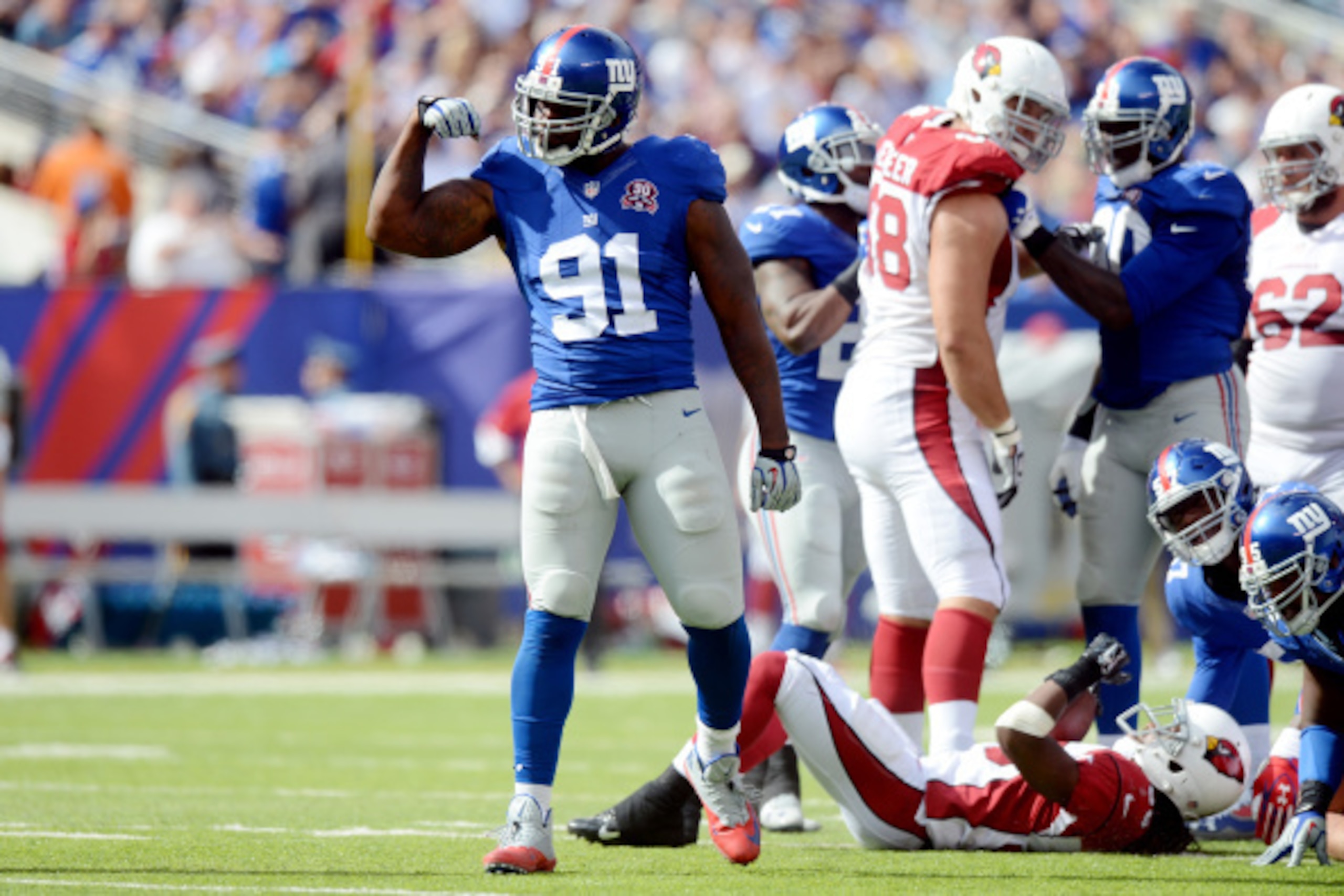 EAST RUTHERFORD, NJ - SEPTEMBER 14: Defensive end Robert Ayers #91 of the New York Giants celebrates a defensive stop against the Arizona Cardinals during a game at MetLife Stadium on September 14, 2014 in East Rutherford, New Jersey. (Photo by Ron Anton EAST RUTHERFORD, NJ - SEPTEMBER 14: Defensive end Robert Ayers #91 of the New York Giants celebrates a defensive stop against the Arizona Cardinals during a game at MetLife Stadium on September 14, 2014 in East Rutherford, New Jersey. (Photo by Ron Anton