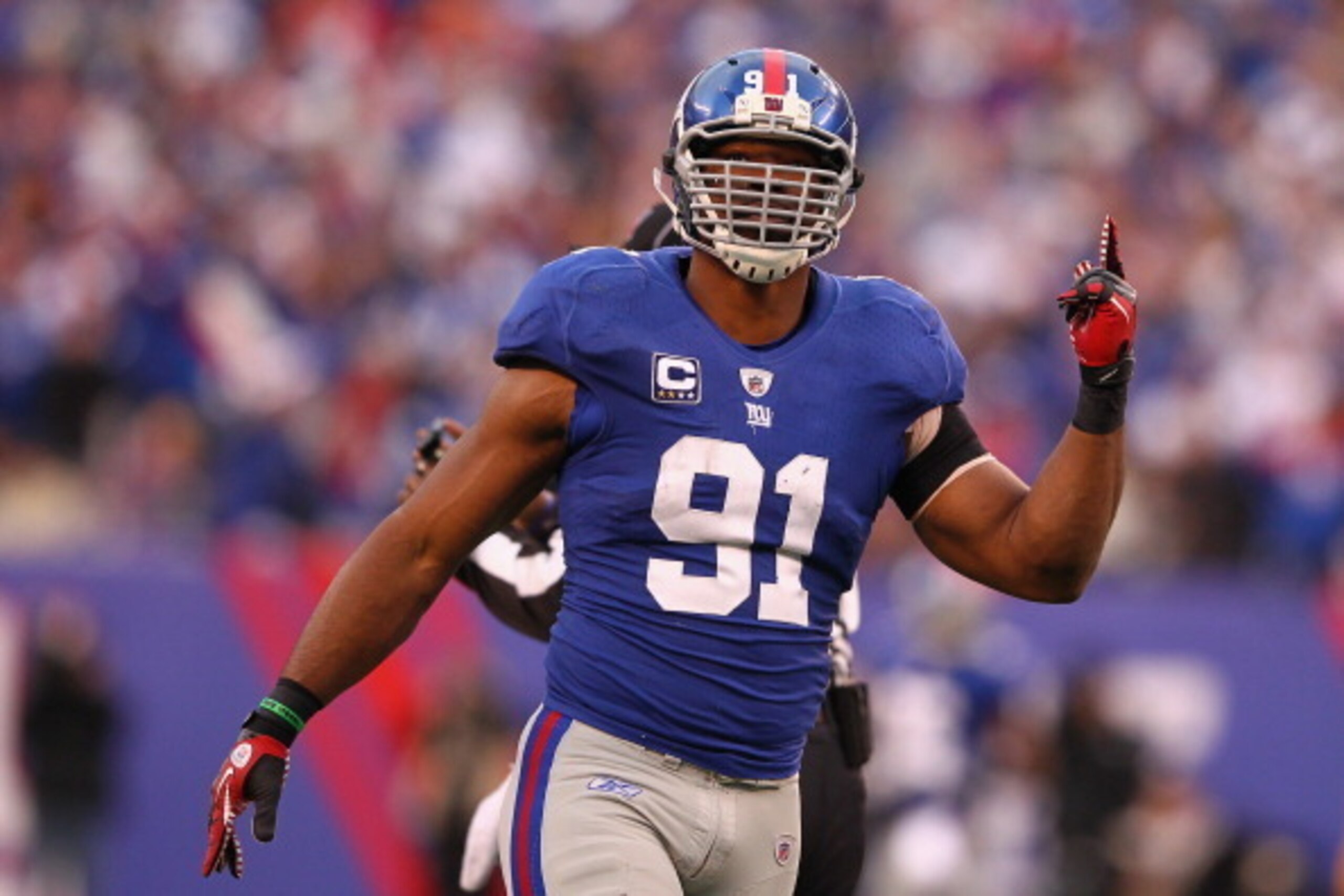 EAST RUTHERFORD, NJ - JANUARY 08: Justin Tuck #91 of the New York Giants reacts against the Atlanta Falcons during their NFC Wild Card Playoff game at MetLife Stadium on January 8, 2012 in East Rutherford, New Jersey. (Photo by Al Bello/Getty Images) EAST RUTHERFORD, NJ - JANUARY 08: Justin Tuck #91 of the New York Giants reacts against the Atlanta Falcons during their NFC Wild Card Playoff game at MetLife Stadium on January 8, 2012 in East Rutherford, New Jersey. (Photo by Al Bello/Getty Images)