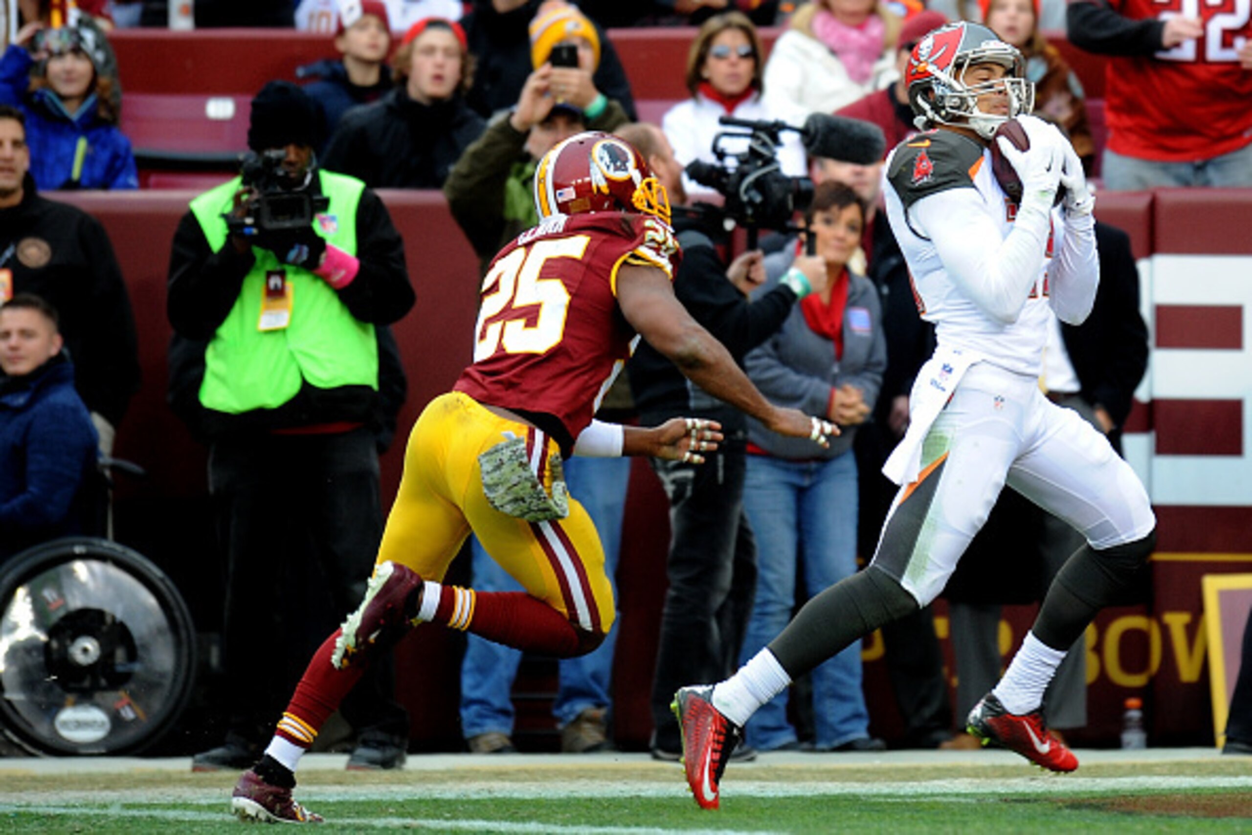 LANDOVER, MD - NOVEMBER 16: Wide receiver Mike Evans #13 of the Tampa Bay Buccaneers makes a 3rd quarter touchdown catch over the defense of free safety Ryan Clark #25 of the Washington Redskins at FedExField on November 16, 2014 in Landover, Maryland. ( LANDOVER, MD - NOVEMBER 16: Wide receiver Mike Evans #13 of the Tampa Bay Buccaneers makes a 3rd quarter touchdown catch over the defense of free safety Ryan Clark #25 of the Washington Redskins at FedExField on November 16, 2014 in Landover, Maryland. (