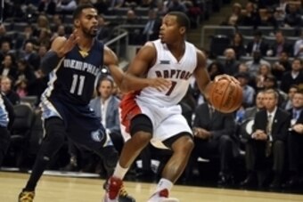 Nov 19, 2014; Toronto, Ontario, CAN; Toronto Raptors guard Kyle Lowry (1) is guarded by Memphis Grizzlies guard Mike Conley (11) during the first half of the Raptors 96-92 win at Air Canada Centre. Mandatory Credit: Dan Hamilton-USA TODAY Sports