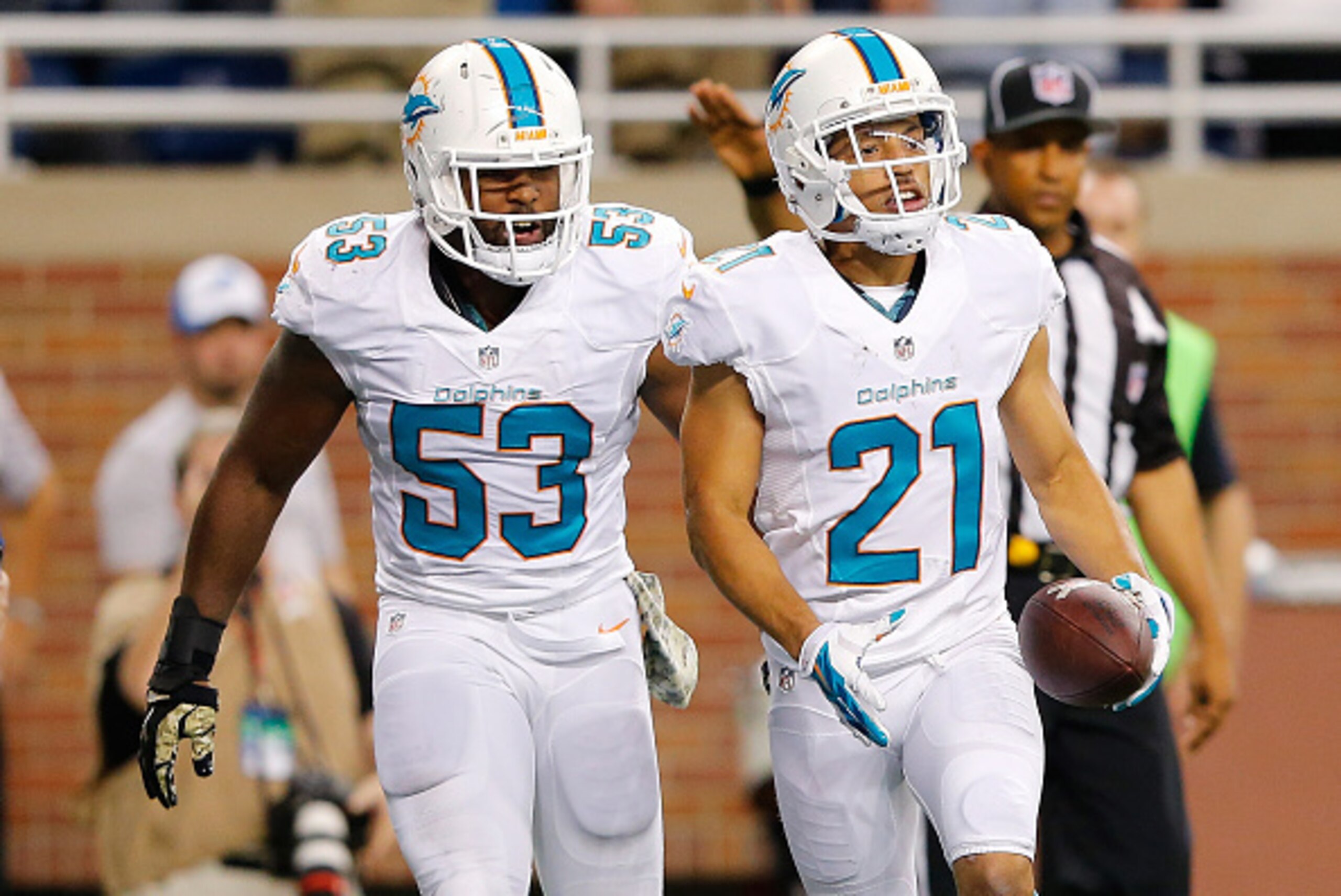 DETROIT, MI - NOVEMBER 09: Brent Grimes #21 celebrates a second quarter interception with Jelani Jenkins #53 of the Miami Dolphins while playing the Detroit Lionsat Ford Field on November 09 , 2014 in Detroit, Michigan. (Photo by Leon Halip/Getty Images) DETROIT, MI - NOVEMBER 09: Brent Grimes #21 celebrates a second quarter interception with Jelani Jenkins #53 of the Miami Dolphins while playing the Detroit Lionsat Ford Field on November 09 , 2014 in Detroit, Michigan. (Photo by Leon Halip/Getty Images)