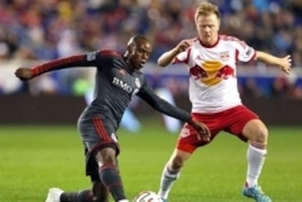 Oct 11, 2014; Harrison, NJ, USA; Toronto FC midfielder Jackson Goncalves (11) controls the ball in front of New York Red Bulls midfielder Dax McCarty (11) during the first half at Red Bull Arena. Mandatory Credit: Adam Hunger-USA TODAY Sports