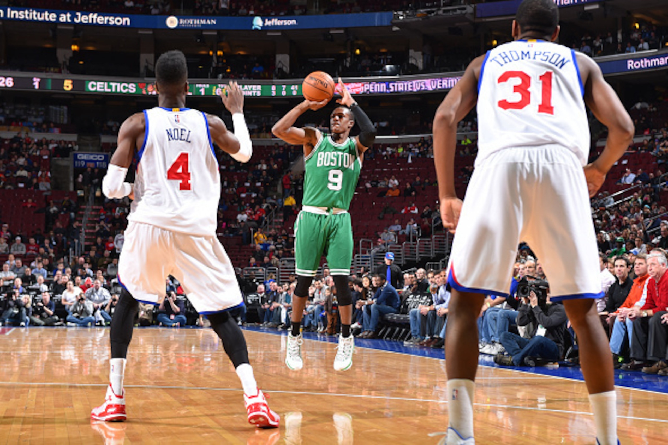 PHILADELPHIA, PA -  NOVEMBER 19: Rajon Rondo #9 of the Boston Celtics shoots against Nerlens Noel #4 and Hollis Thompson #31 of the Philadelphia 76ers during the game on November 19, 2014 at Wells Fargo Center in Philadelphia, Pennsylvania. NOTE TO USER: 