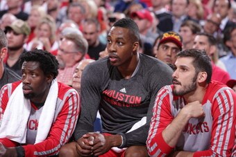 PORTLAND, OR - MAY 2:  Dwight Howard #12 of the Houston Rockets sits on the bench in Game Six of the Western Conference Quarterfinals against the Portland Trail Blazers during the 2014 NBA Playoffs on May 2, 2014 at the Moda Center in Portland, Oregon. NO
