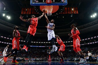 PHILADELPHIA, PA - NOVEMBER 3: Terrence Jones #6 of the Houston Rockets grabs a rebound against Brandon Davies #0 of the Philadelphia 76ers on November 3, 2014 at the Wells Fargo Center in Philadelphia, Pennsylvania. NOTE TO USER: User expressly acknowled