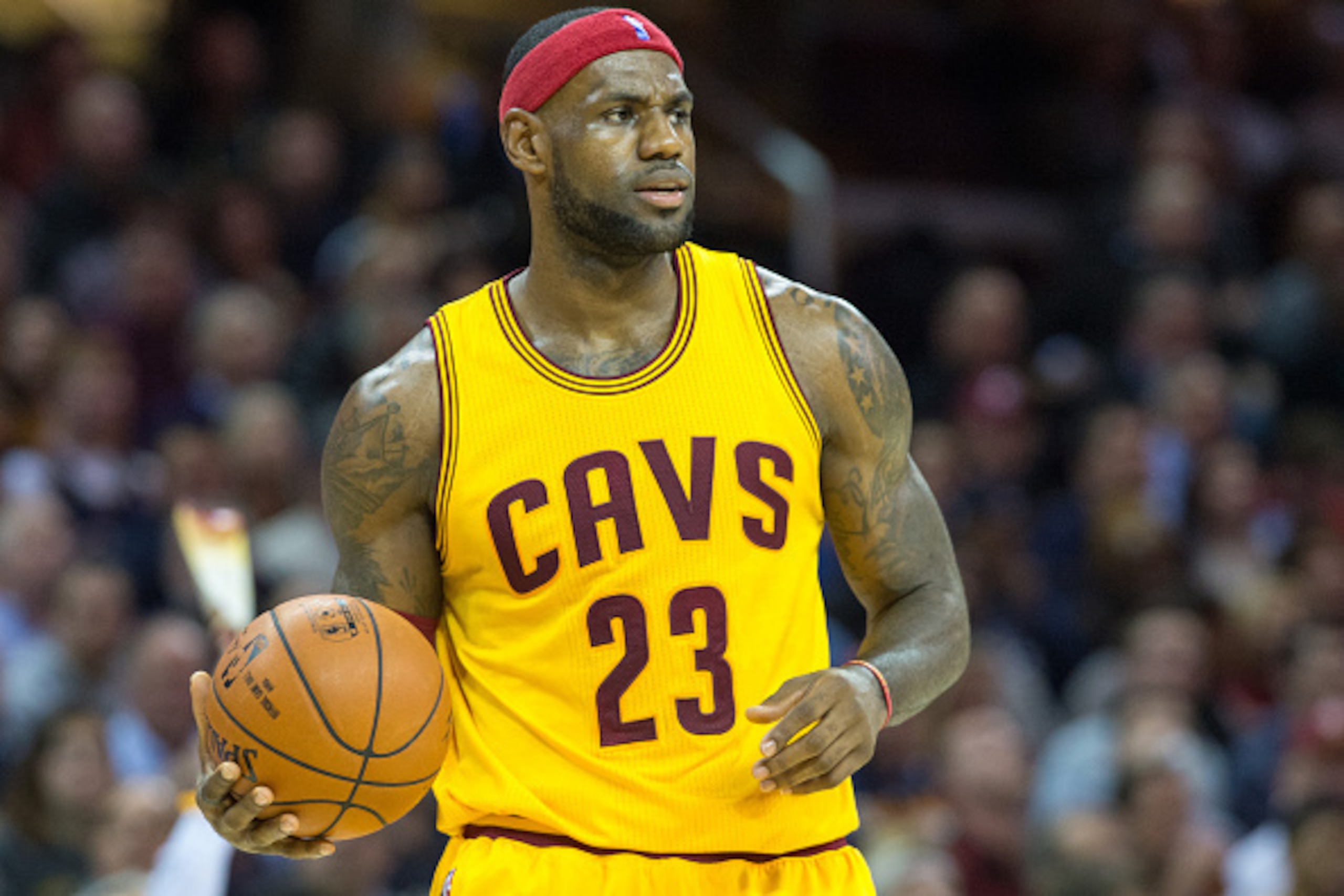 CLEVELAND, OH - NOVEMBER 19: LeBron James #23 of the Cleveland Cavaliers reacts during the first half against the San Antonio Spurs at Quicken Loans Arena on November 19, 2014 in Cleveland, Ohio. User expressly acknowledges and agrees that, by downloading