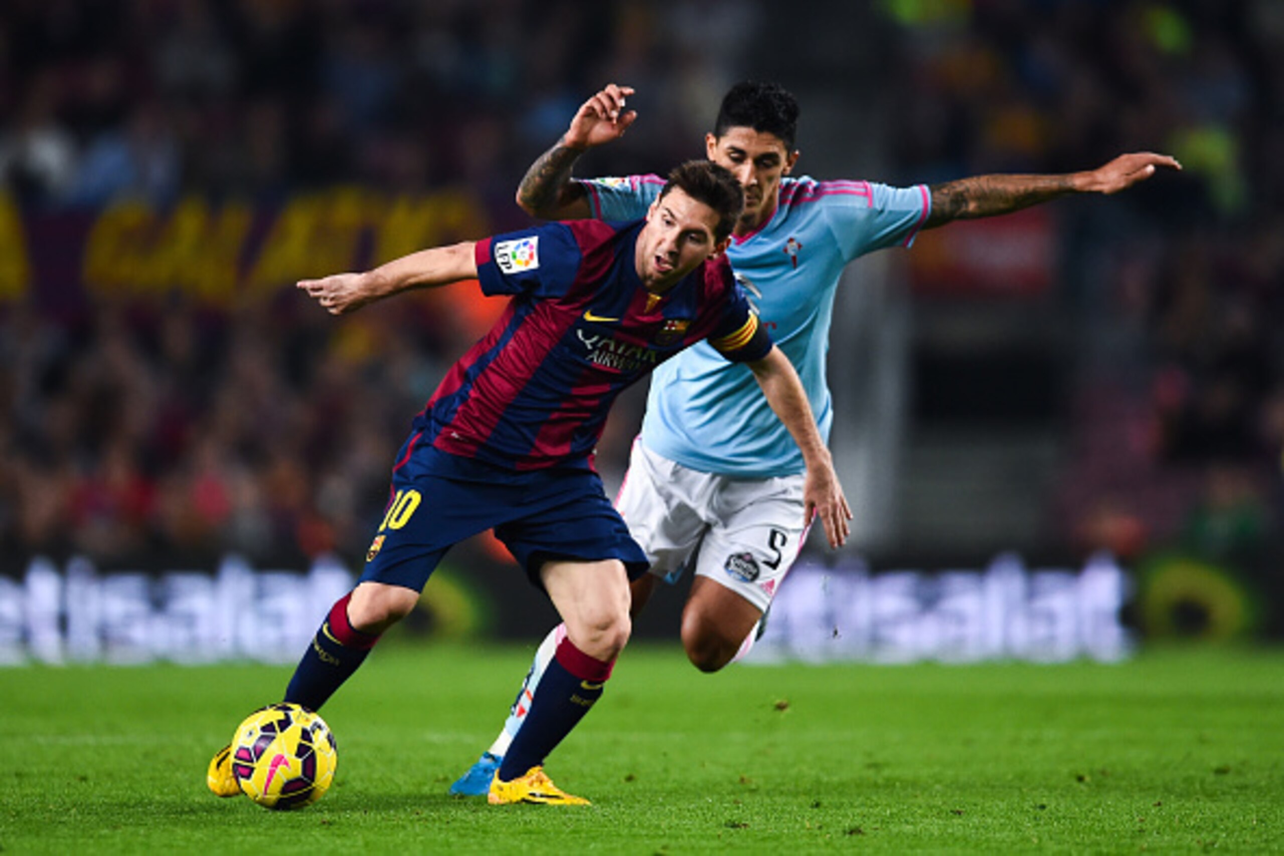 BARCELONA, SPAIN - NOVEMBER 01:  Lionel Messi of FC Barcelona competes for the ball with Charles of Celta de Vigo the La Liga match between FC Barcelona and Celta de Vigo at Camp Nou on November 1, 2014 in Barcelona, Spain.  (Photo by David Ramos/Getty Im
