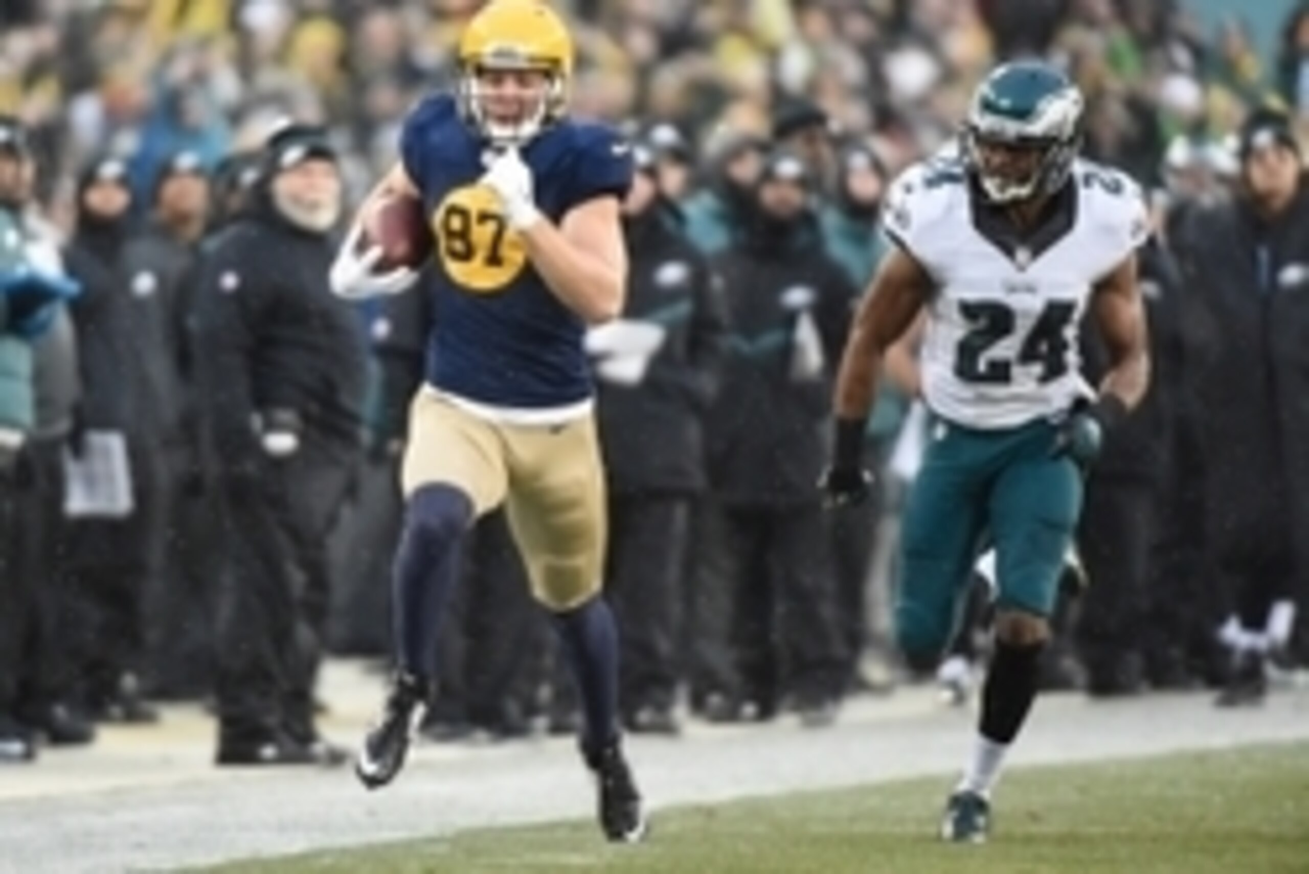 Nov 16, 2014; Green Bay, WI, USA;  Green Bay Packers wide receiver Jordy Nelson (87) runs past Philadelphia Eagles cornerback Bradley Fletcher (24) after catching a pass for a 64-yard gain in the first quarter at Lambeau Field. Mandatory Credit: Benny Sie