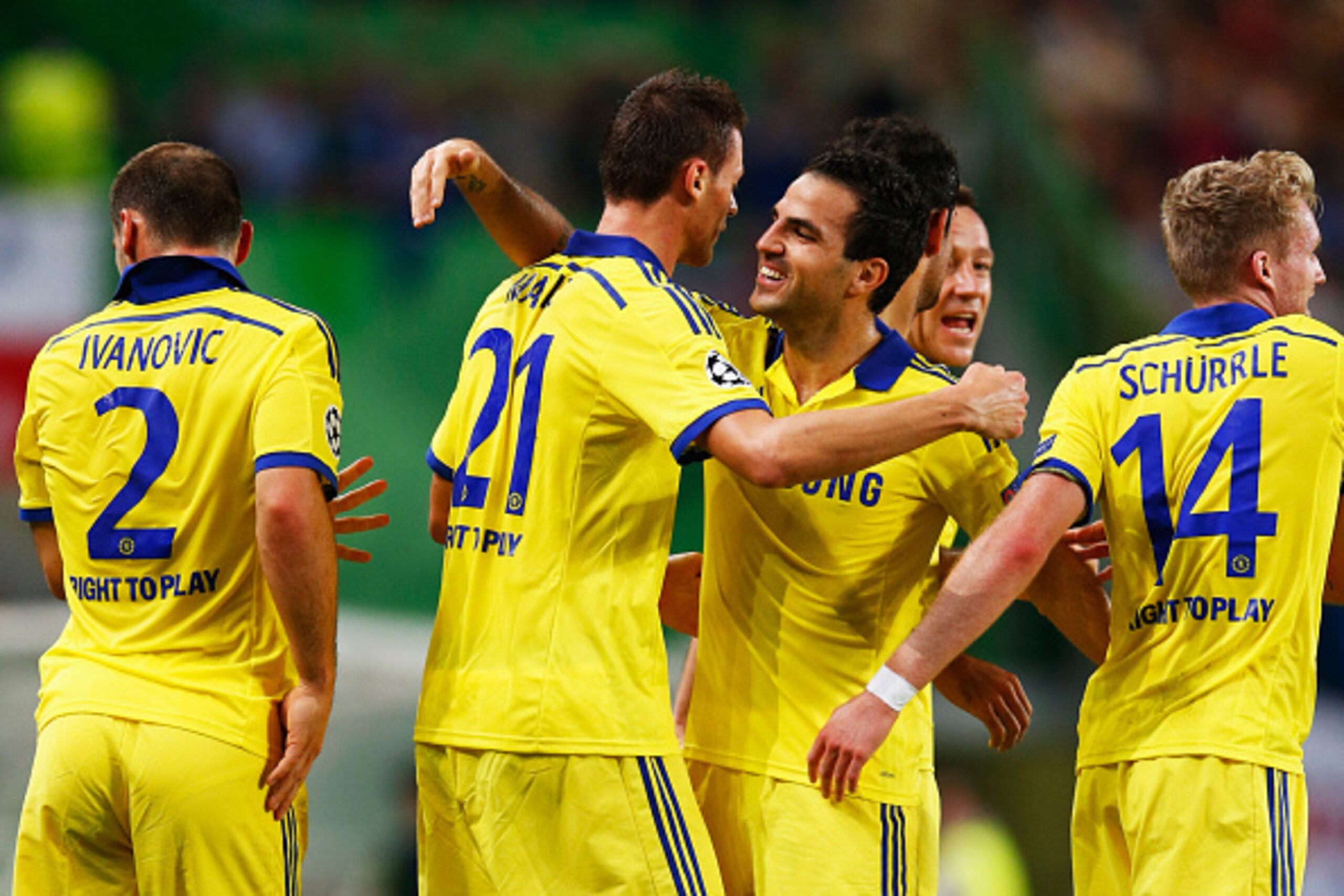 LISBON, PORTUGAL - SEPTEMBER 30:  Nemanja Matic of Chelsea (21) celebrates with team mate Cesc Fabregas as he scores their first goal  during the UEFA Champions League Group G match between Sporting Clube de Portugal and Chelsea FC at Estadio Jose Alvalad