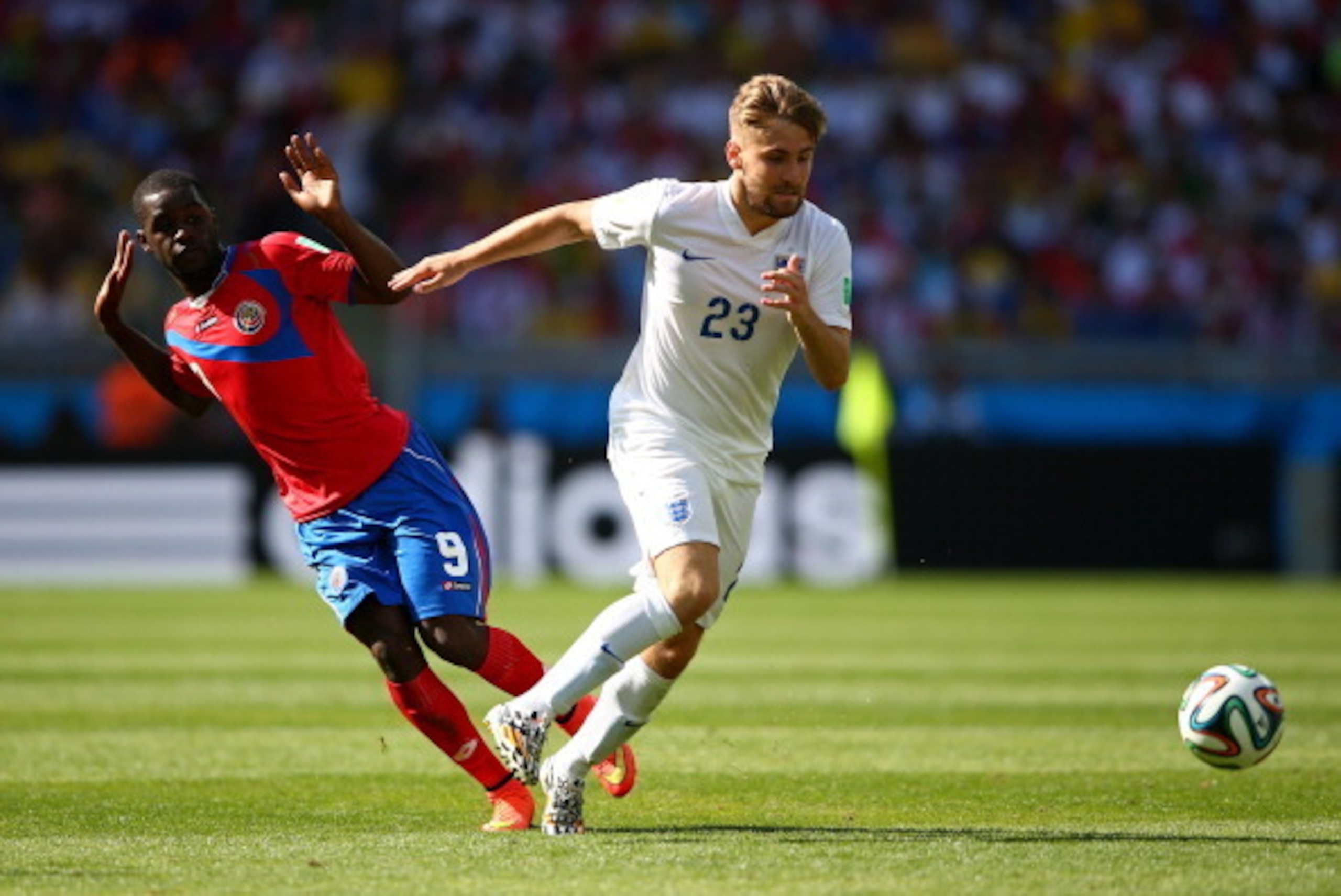 BELO HORIZONTE, BRAZIL - JUNE 24:  Luke Shaw of England competes for the ball with Joel Campbell of Costa Rica during the 2014 FIFA World Cup Brazil Group D match between Costa Rica and England at Estadio Mineirao on June 24, 2014 in Belo Horizonte, Brazi
