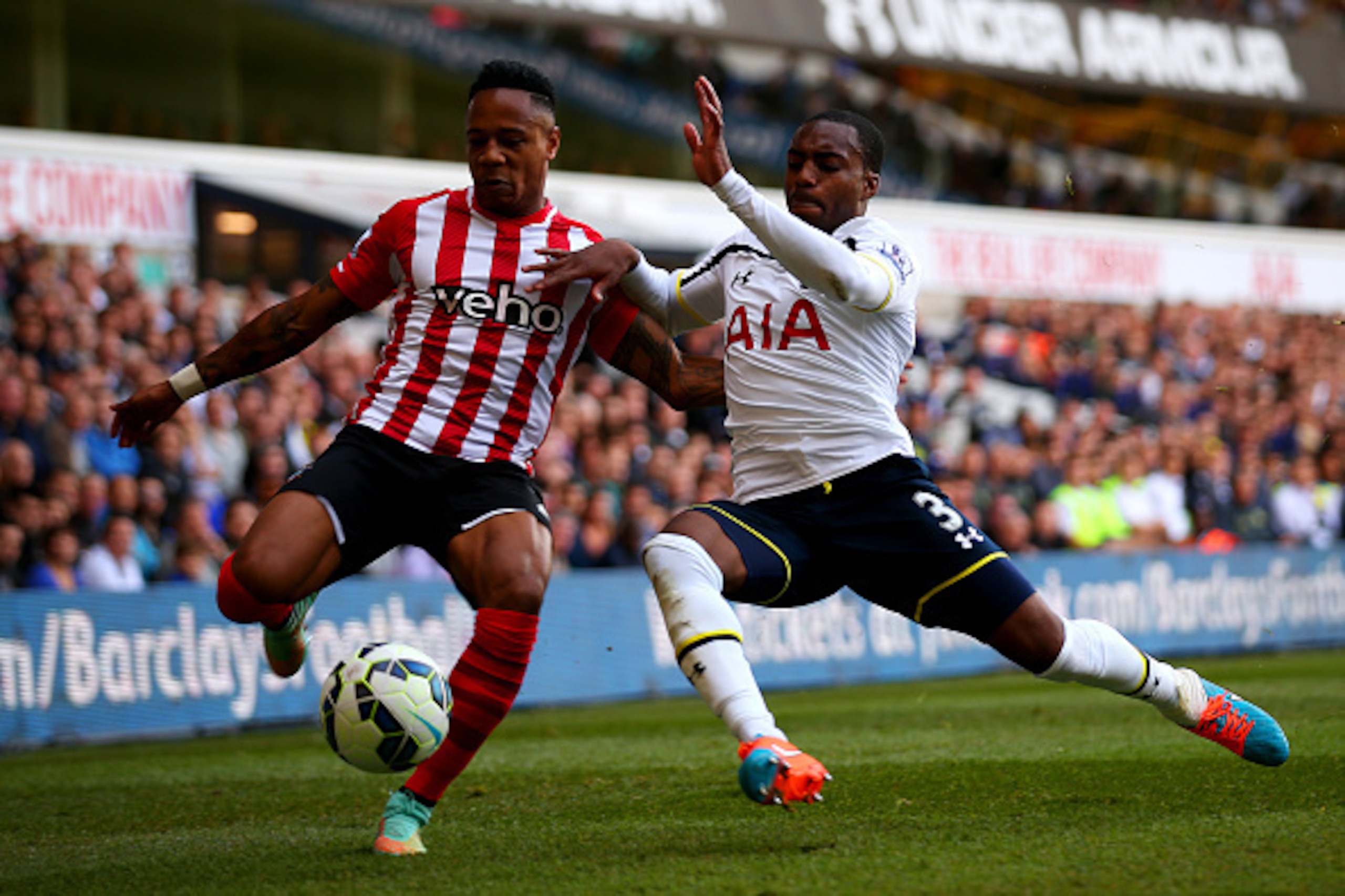 LONDON, ENGLAND - OCTOBER 05:  Nathaniel Clyne of Southampton battles for the ball with Danny Rose of Spurs during the Barclays Premier League match between Tottenham Hotspur and Southampton at White Hart Lane on October 5, 2014 in London, England.  (Phot
