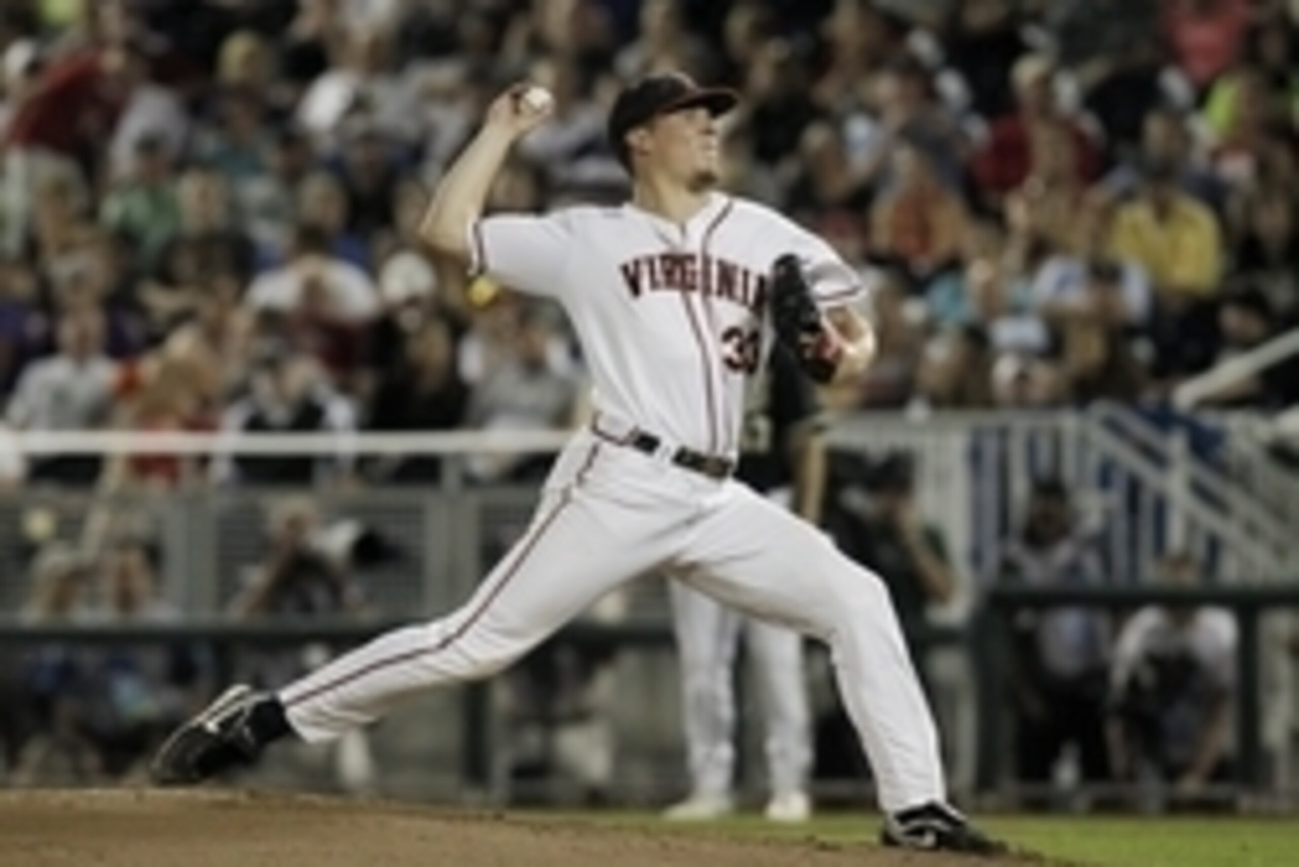 Jun 25, 2014; Omaha, NE, USA; Virginia Cavaliers pitcher Nick Howard (33) throws against the Vanderbilt Commodores during game three of the College World Series Finals at TD Ameritrade Park Omaha. Vanderbilt won 3-2. Howard was the losing pitcher. Mandato