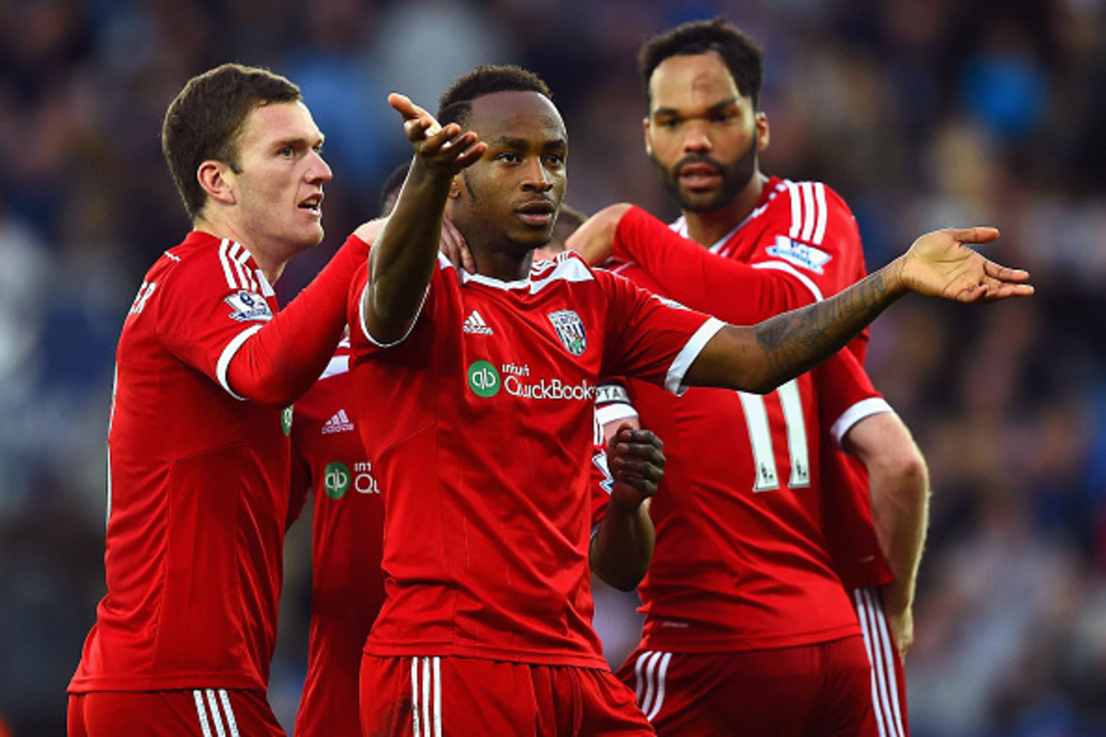 LEICESTER, ENGLAND - NOVEMBER 01:  Saido Berahino of West Brom celebrates with team mates after Esteban Cambiasso of Leicester City scored an own goal during the Barclays Premier League match between Leicester City and West Bromwich Albion at The King Pow