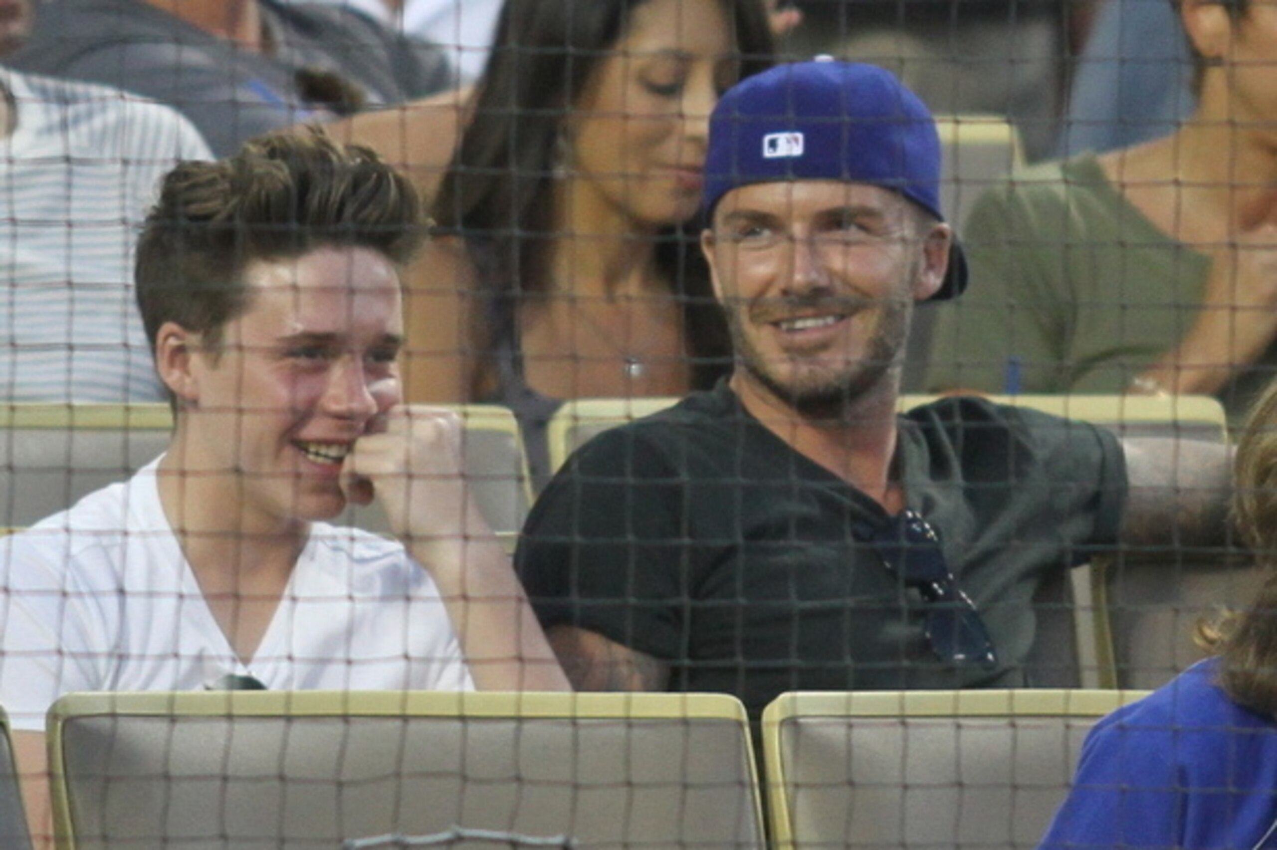 Brooklyn Beckham and his father, David, at an LA Dodgers game Brooklyn Beckham and his father, David, at an LA Dodgers game