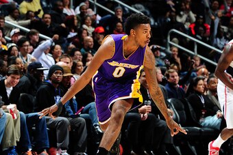 ATLANTA, GA - NOVEMBER 18: Nick Young #0 of the Los Angeles Lakers celebrates after scoring against the Atlanta Hawks on November 18, 2014 at Philips Arena in Atlanta, Georgia.  NOTE TO USER: User expressly acknowledges and agrees that, by downloading and