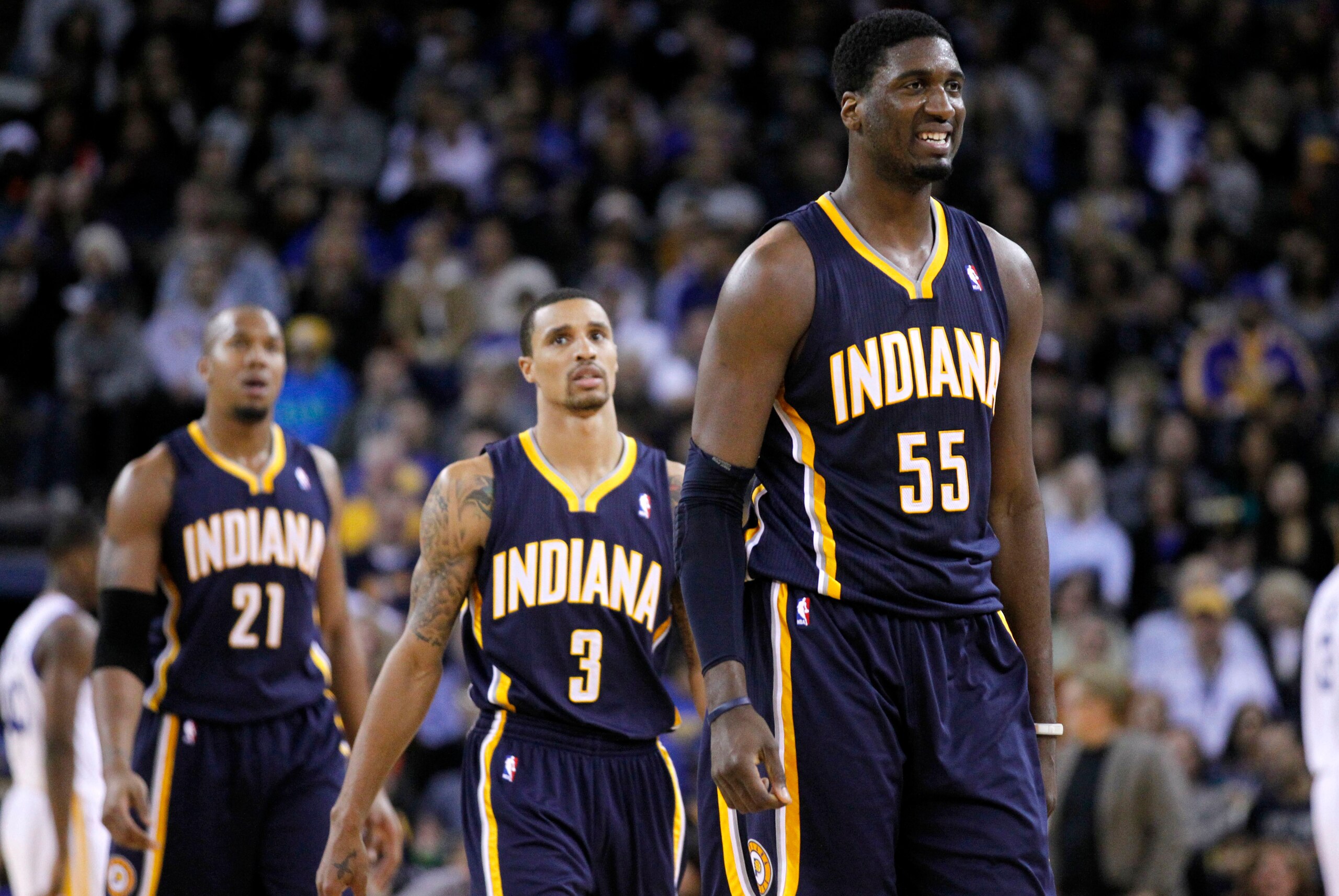 December 1, 2012; Oakland, CA, USA; Indiana Pacers center Roy Hibbert (55), guard George Hill (3) and forward David West (21) walk to the team bench during a timeout against the Golden State Warriors in the second quarter at ORACLE Arena. Mandatory Credit