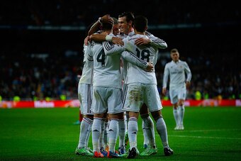 MADRID, SPAIN - NOVEMBER 08: Gareth Bale (2ndR) of Real Madrid CF embraces his teammate Sergio Ramos (2ndL) celbrating their second goal with Nacho Fernandez (R) and Pepe (L) during the La Liga match between Real Madrid CF and Rayo Vallecano de Madrid at 