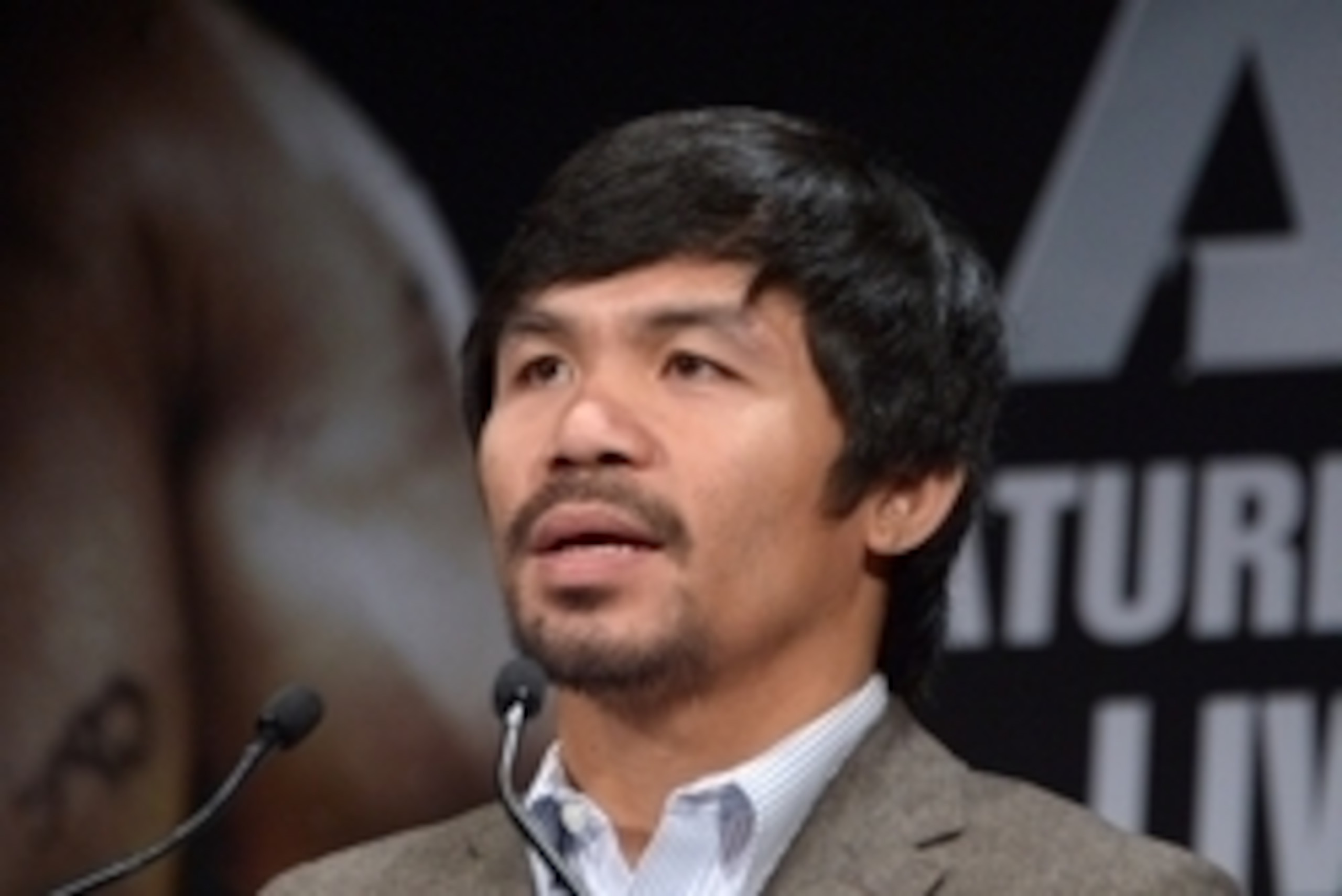 Sep 3, 2014; Los Angeles, CA, USA; Manny Pacquiao poses at press conference at Hyatt Regency Century Plaza Hotel in advance of World Welterweight Championship bout against Chris Algieri (not pictured) on Nov. 22, 2014. Mandatory Credit: Kirby Lee-USA TODA