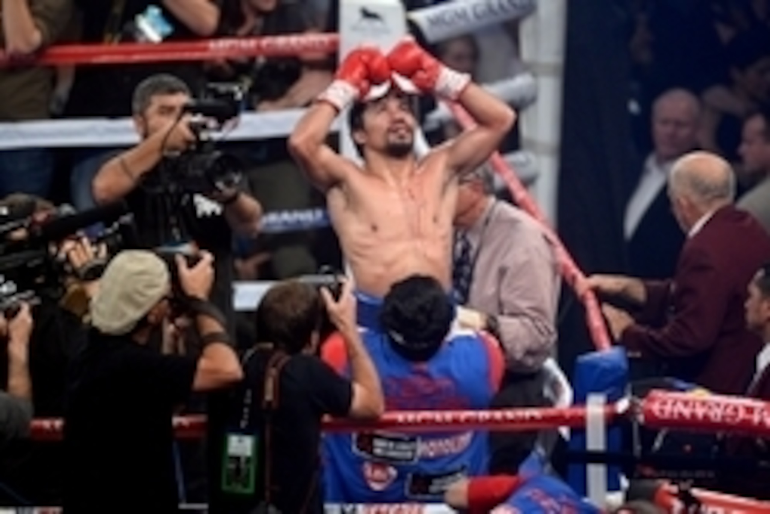 Apr 12, 2014; Las Vegas, NV, USA; Manny Pacquiao  celebrates his victory over Timothy Bradley (not pictured) after their WBO World Welterweight Title bout at MGM Grand Garden Arena. Pacquiao won via unanimous decision. Mandatory Credit: Joe Camporeale-USA