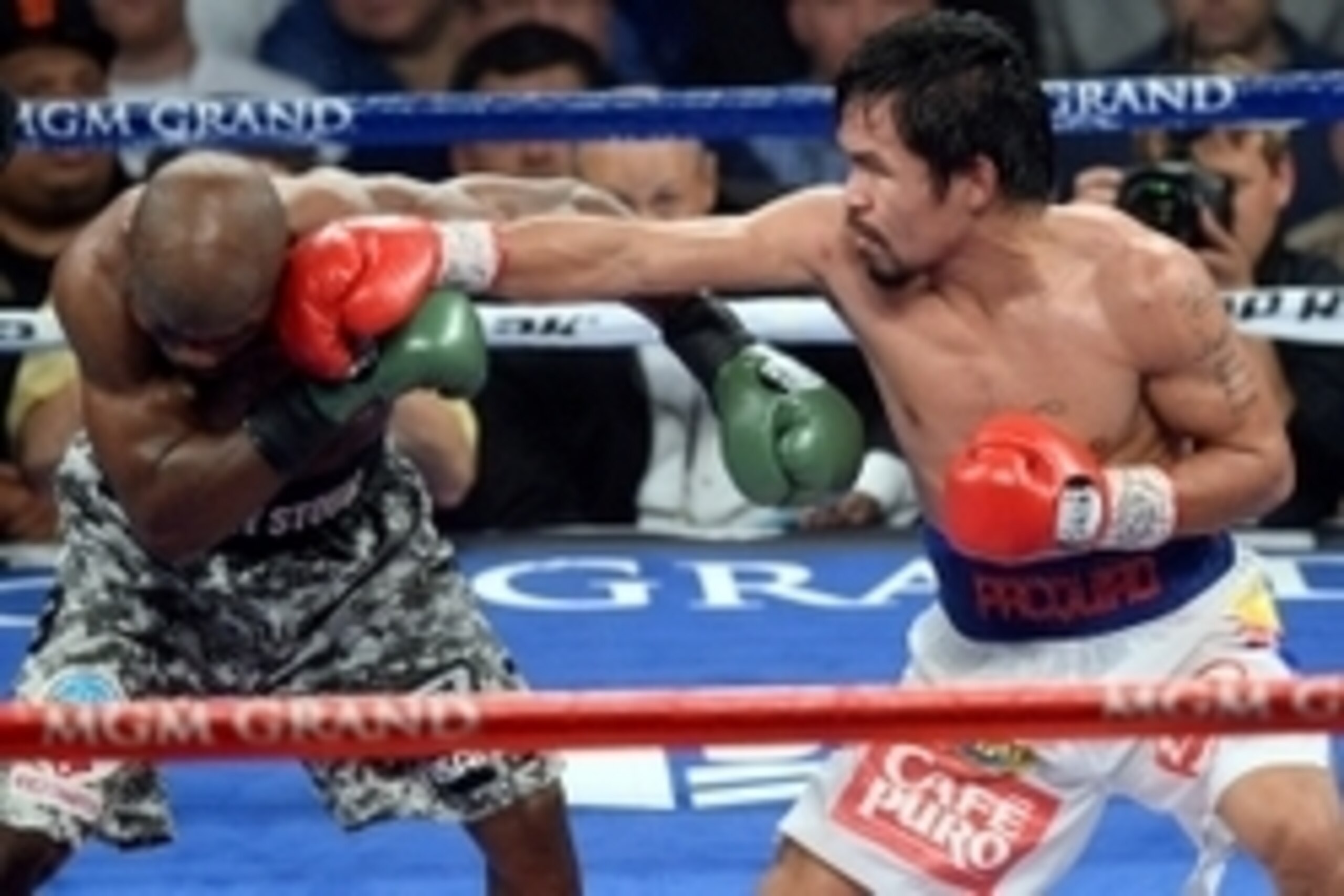 Apr 12, 2014; Las Vegas, NV, USA; Timothy Bradley (green gloves) and Manny Pacquiao (red gloves) box during their WBO World Welterweight Title bout at MGM Grand Garden Arena. Pacquiao won via unanimous decision. Mandatory Credit: Joe Camporeale-USA TODAY 