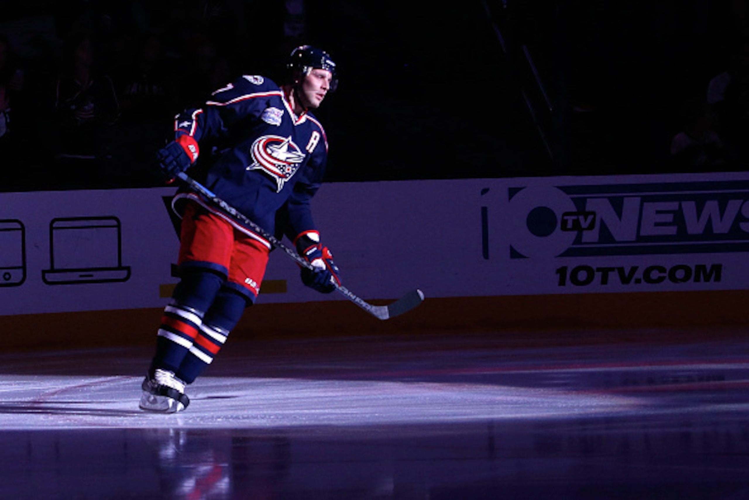 COLUMBUS, OH - OCTOBER 14: Jack Johnson #7 of the Columbus Blue Jackets is spotlit during the starting line up announcements prior to the start of the game against the Dallas Stars on October 14, 2014 at Nationwide Arena in Columbus, Ohio. (Photo by Kirk