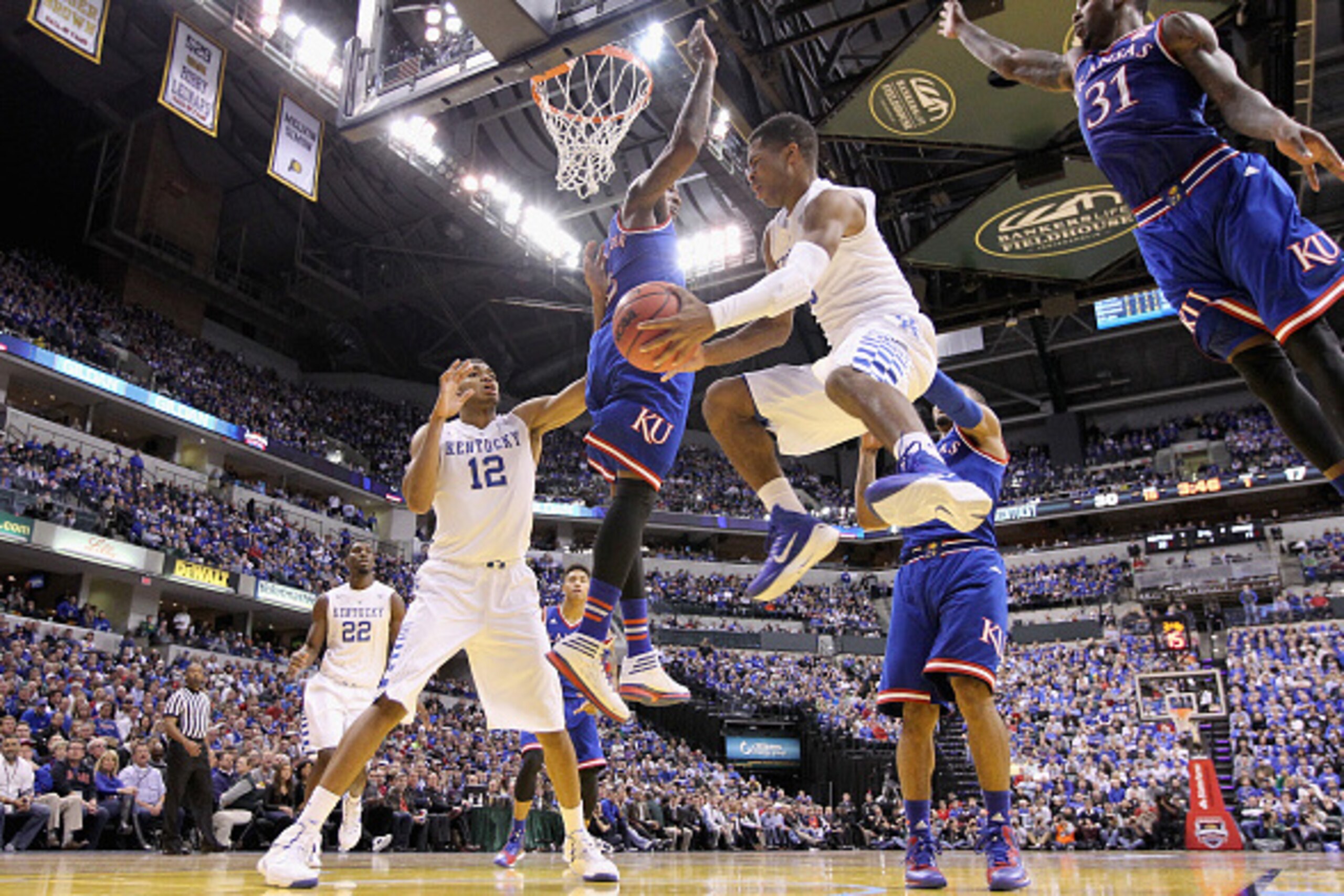 INDIANAPOLIS, IN - NOVEMBER 18: Andrew Harrison #5 of the Kentucky Wildcats passes the ball during the game against the Kansas Jayhwaks in the State Farm Champions Classic at Bankers Life Fieldhouse on November 18, 2014 in Indianapolis, Indiana. (Photo INDIANAPOLIS, IN - NOVEMBER 18: Andrew Harrison #5 of the Kentucky Wildcats passes the ball during the game against the Kansas Jayhwaks in the State Farm Champions Classic at Bankers Life Fieldhouse on November 18, 2014 in Indianapolis, Indiana. (Photo