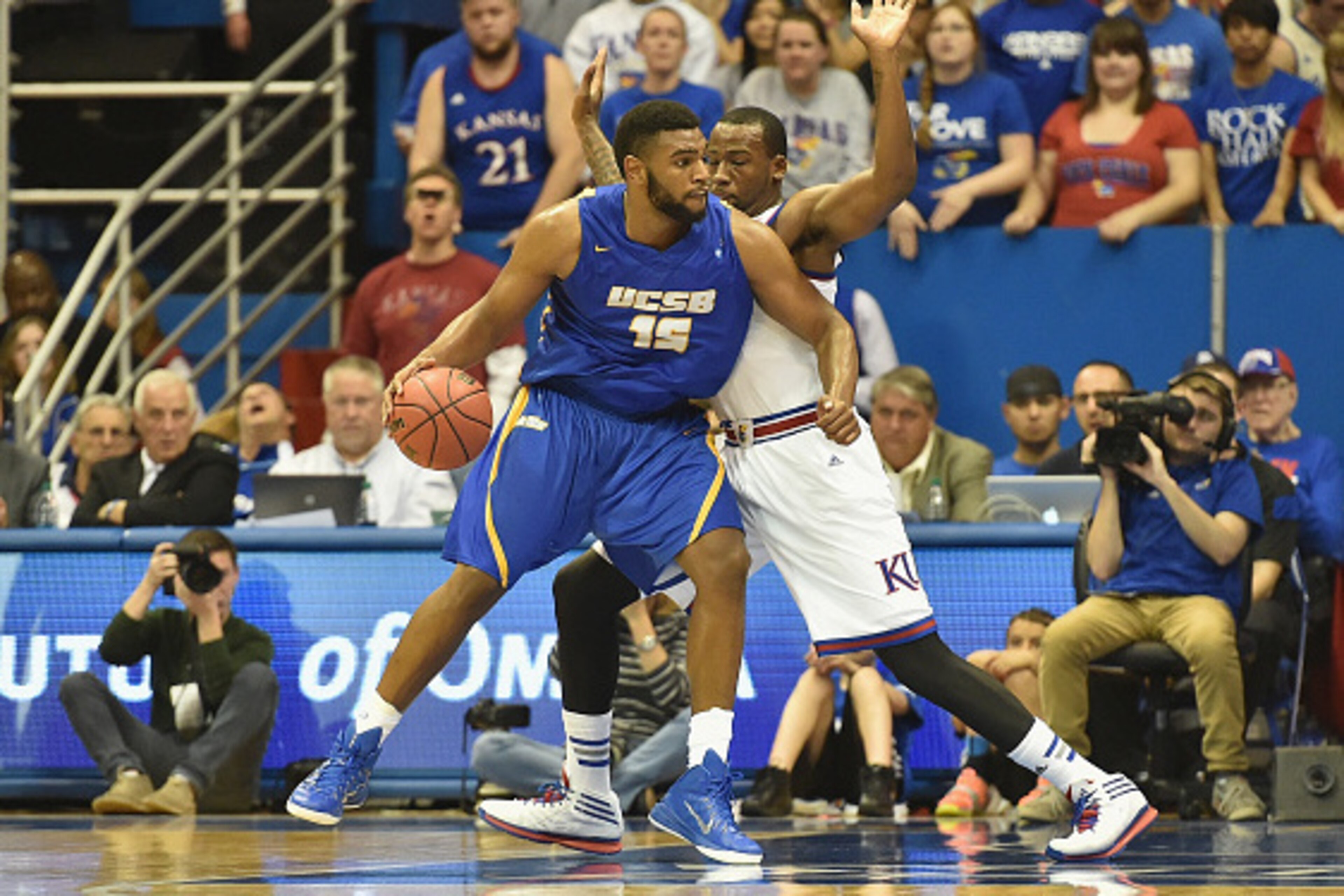 LAWRENCE, KS - NOVEMBER 14:  Alan Williams #15 of the UC Santa Barbara Gauchos posts up Cliff Alexander #2 of the Kansas Jayhawks in the second half at Allen Fieldhouse on November 14, 2014 in Lawrence, Kansas. (Photo by Michael B. Thomas/Getty Images)