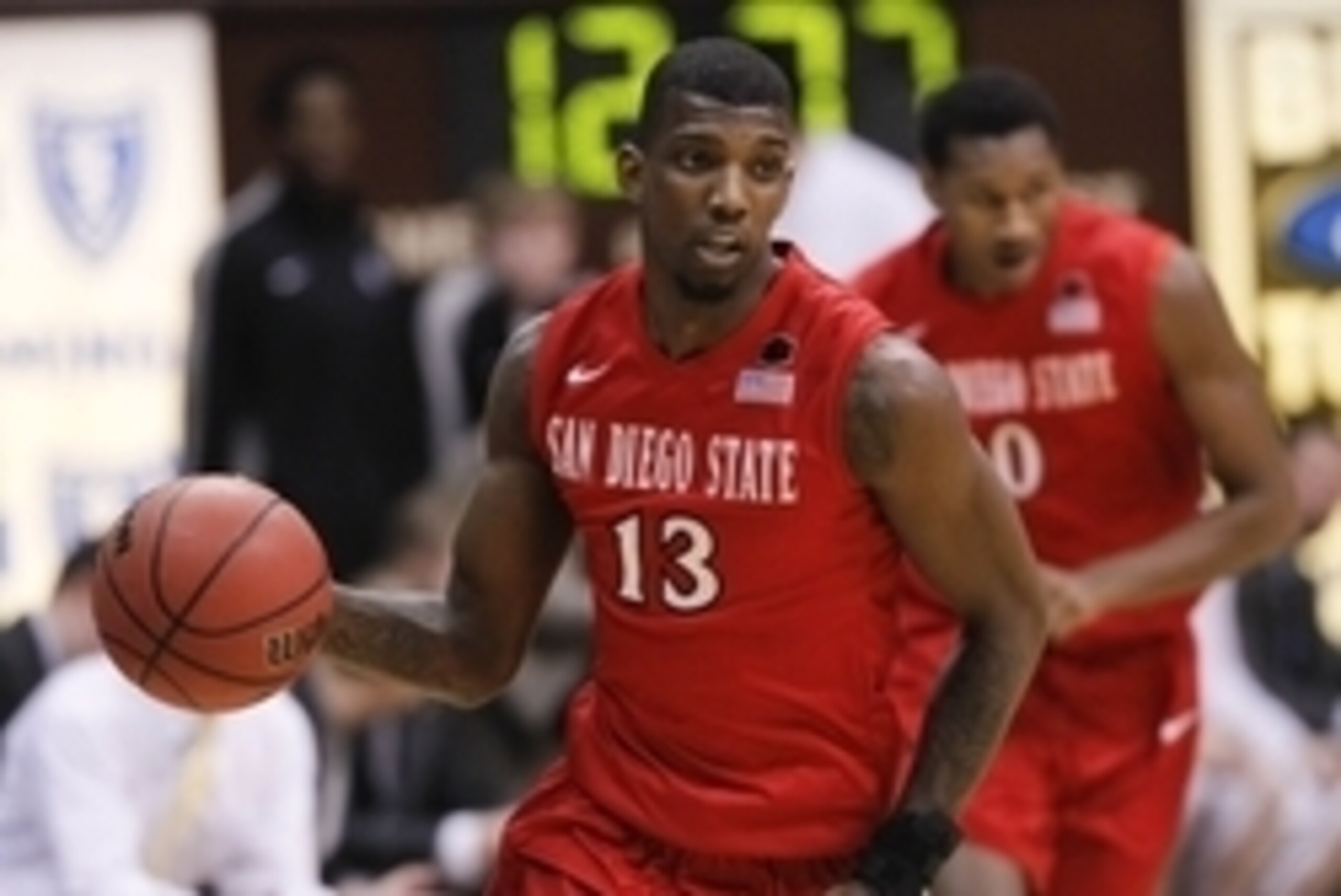 Feb 11, 2014; Laramie, WY, USA; San Diego State Aztecs forward Winston Shepard (13) dribbles the ball against the Wyoming Cowboys during the second half at Arena-Auditorium. The Cowboys won 68-62. Mandatory Credit: Troy Babbitt-USA TODAY Sports