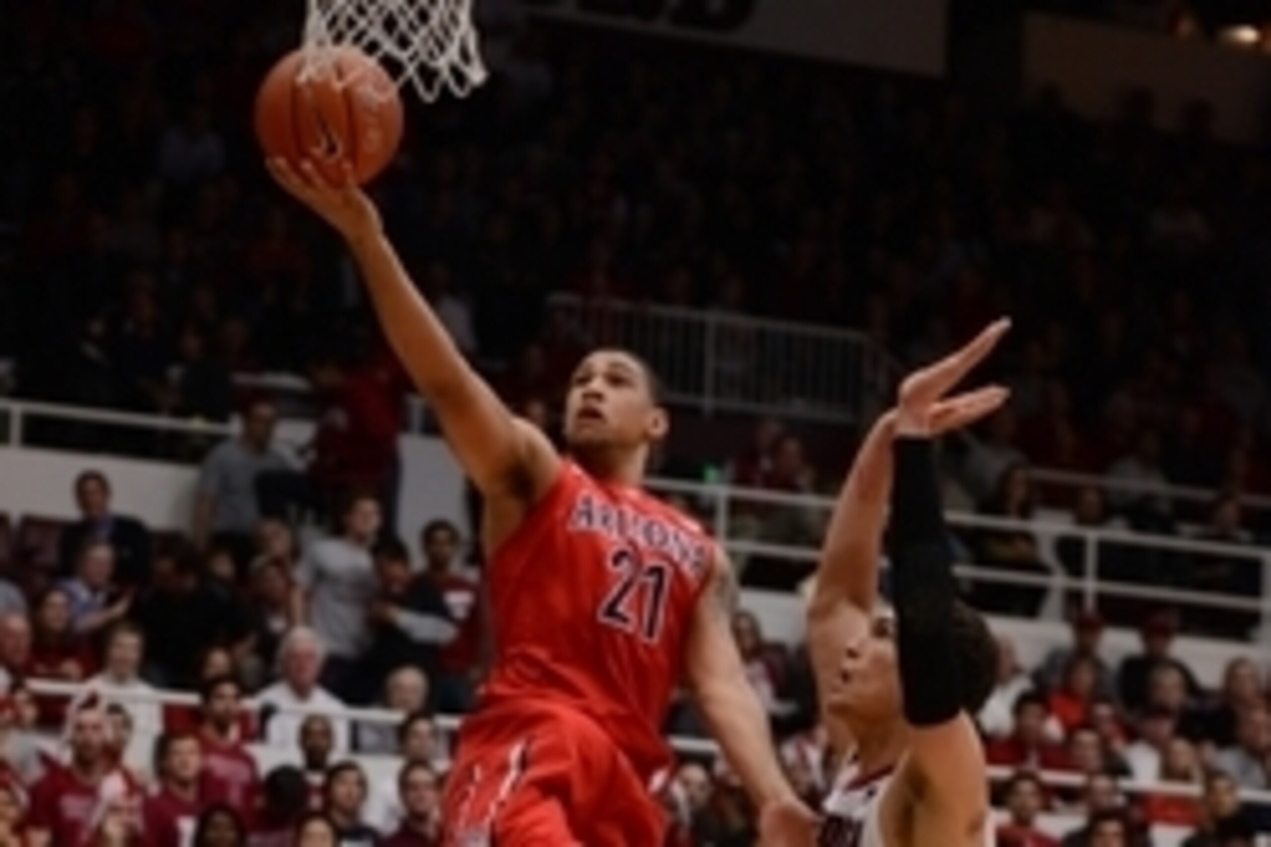 January 29, 2014; Stanford, CA, USA; Arizona Wildcats forward Brandon Ashley (21) drives to the basket past Stanford Cardinal forward Dwight Powell (33) during the first half at Maples Pavilion. Mandatory Credit: Kyle Terada-USA TODAY Sports