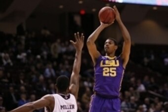 Feb 12, 2014; College Station, TX, USA; LSU Tigers forward Jordan Mickey (25) shoots the ball over Texas A&M Aggies forward Tavario Miller (4) during the first half at Reed Arena. Mandatory Credit: Soobum Im-USA TODAY Sports
