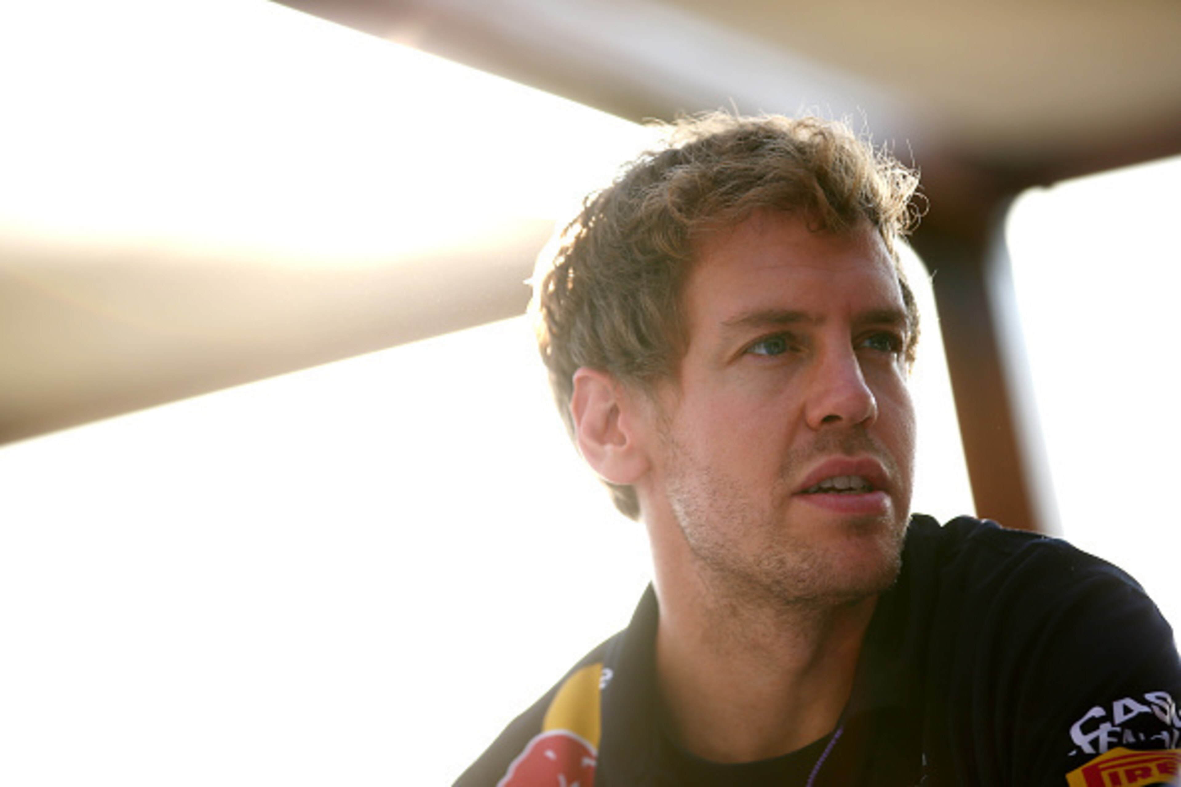 ABU DHABI, UNITED ARAB EMIRATES - NOVEMBER 20:  Sebastian Vettel of Germany and Infiniti Red Bull Racing speaks with members of the media during previews ahead of the Abu Dhabi Formula One Grand Prix at Yas Marina Circuit on November 20, 2014 in Abu Dhabi