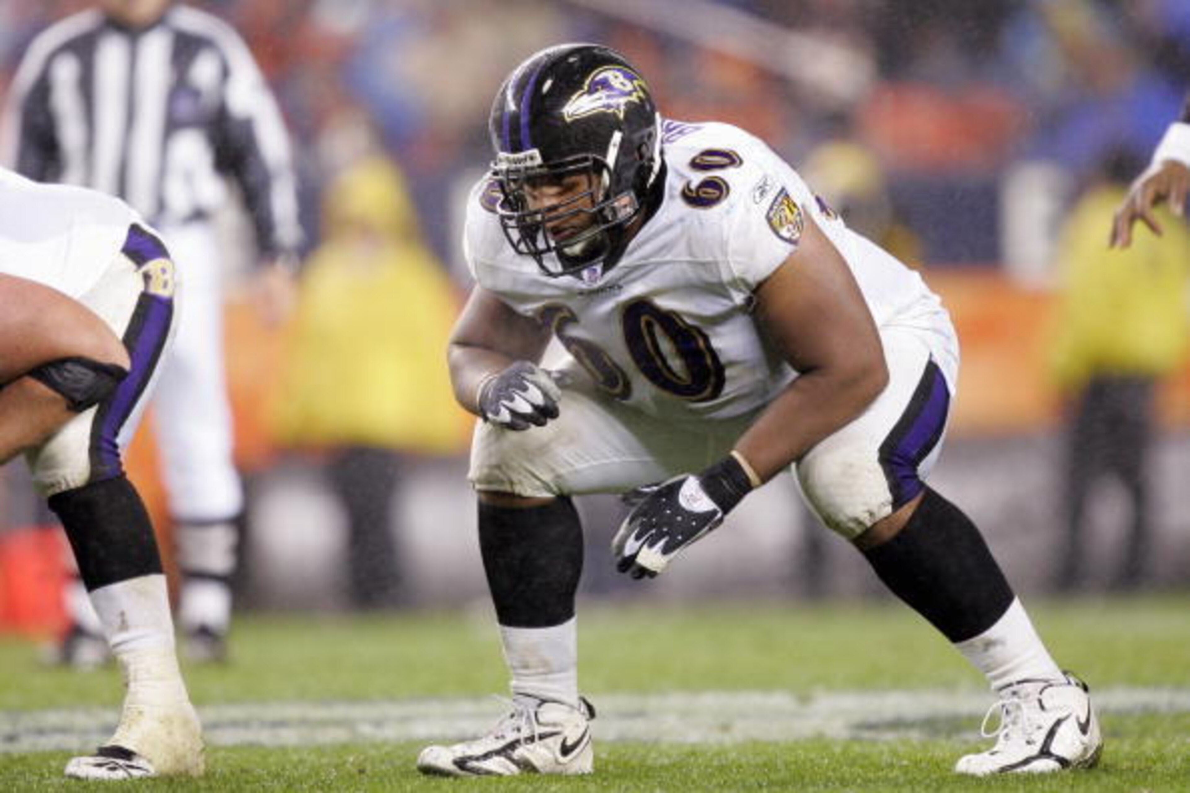 DENVER - OCTOBER 9:  Jason Brown #60 of the Baltimore Ravens gets ready on the line of scrimmage during the game against the Denver Broncos on October 9, 2006 at Invesco Field at Mile High in Denver, Colorado.  The Broncos won 13-3.  (Photo by Brian Bahr/