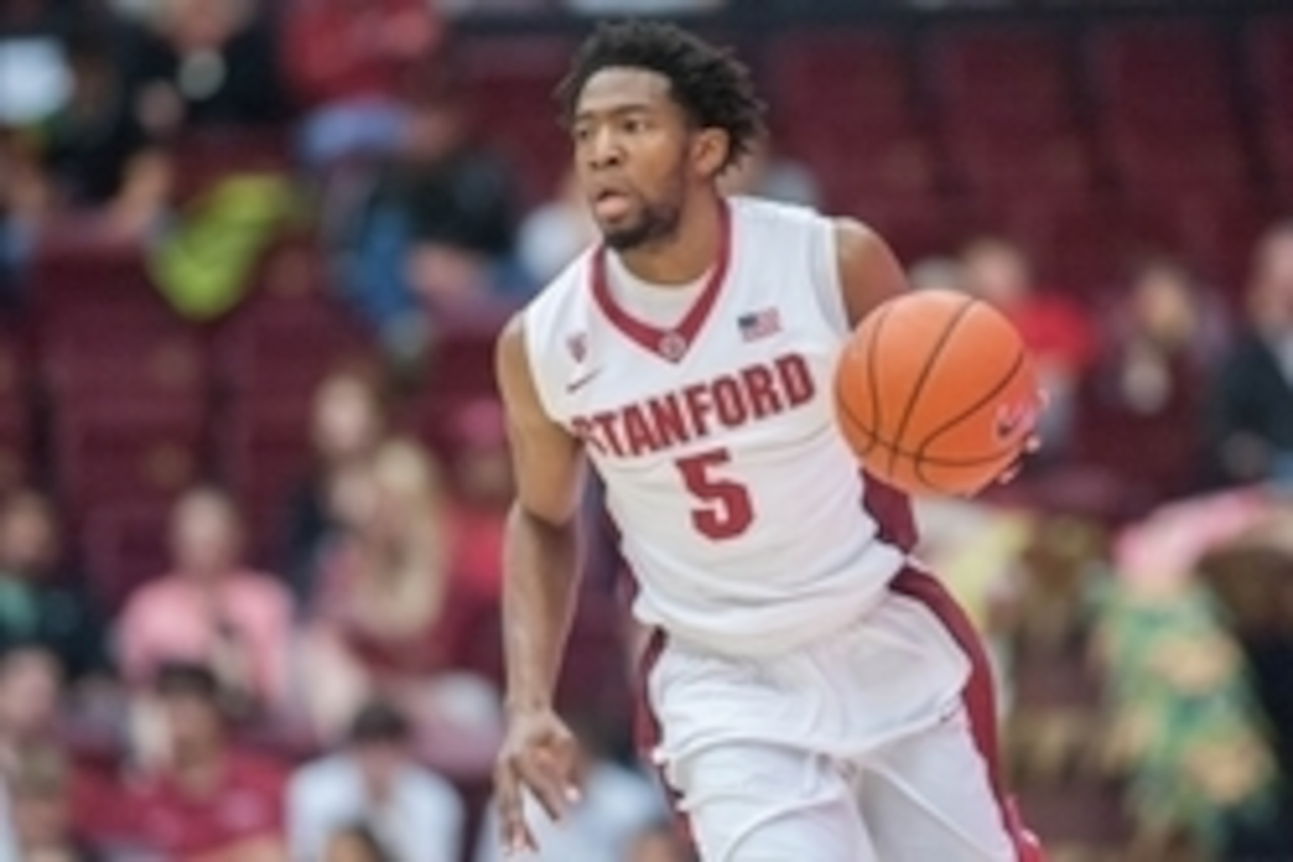 Nov 16, 2014; Stanford, CA, USA; Stanford Cardinal guard Chasson Randle (5) dribbles the ball up the court during the second half of the game against the South Dakota Coyotes at Maples Pavilion. The Stanford Cardinal defeated the South Dakota Coyotes 84-7