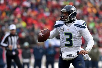 KANSAS CITY, MO - NOVEMBER 16: Russell Wilson #3 of the Seattle Seahawks looks to pass against the Kansas City Chiefs during the first half at Arrowhead Stadium on November 16, 2014 in Kansas City, Missouri. (Photo by Peter Aiken/Getty Images)