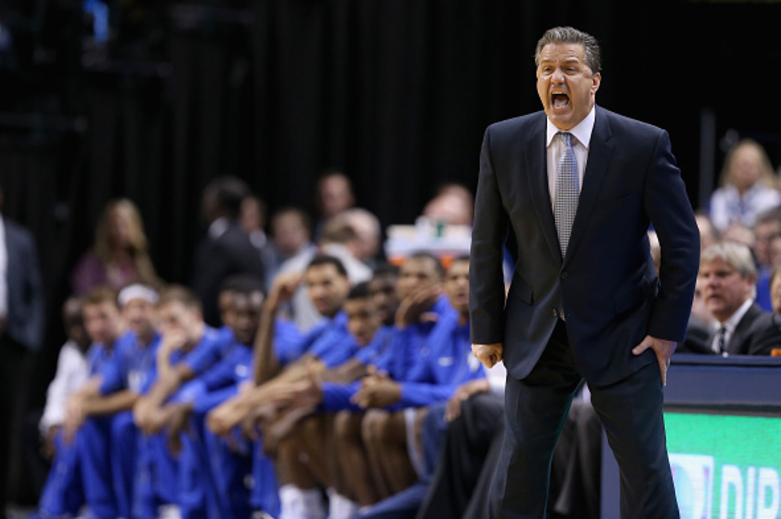 INDIANAPOLIS, IN - NOVEMBER 18:  John Calipari the head coach of the Kentucky Wildcats gives instructions to his team during the game against the Kansas Jayhwaks in the State Farm Champions Classic at Bankers Life Fieldhouse on November 18, 2014 in Indian