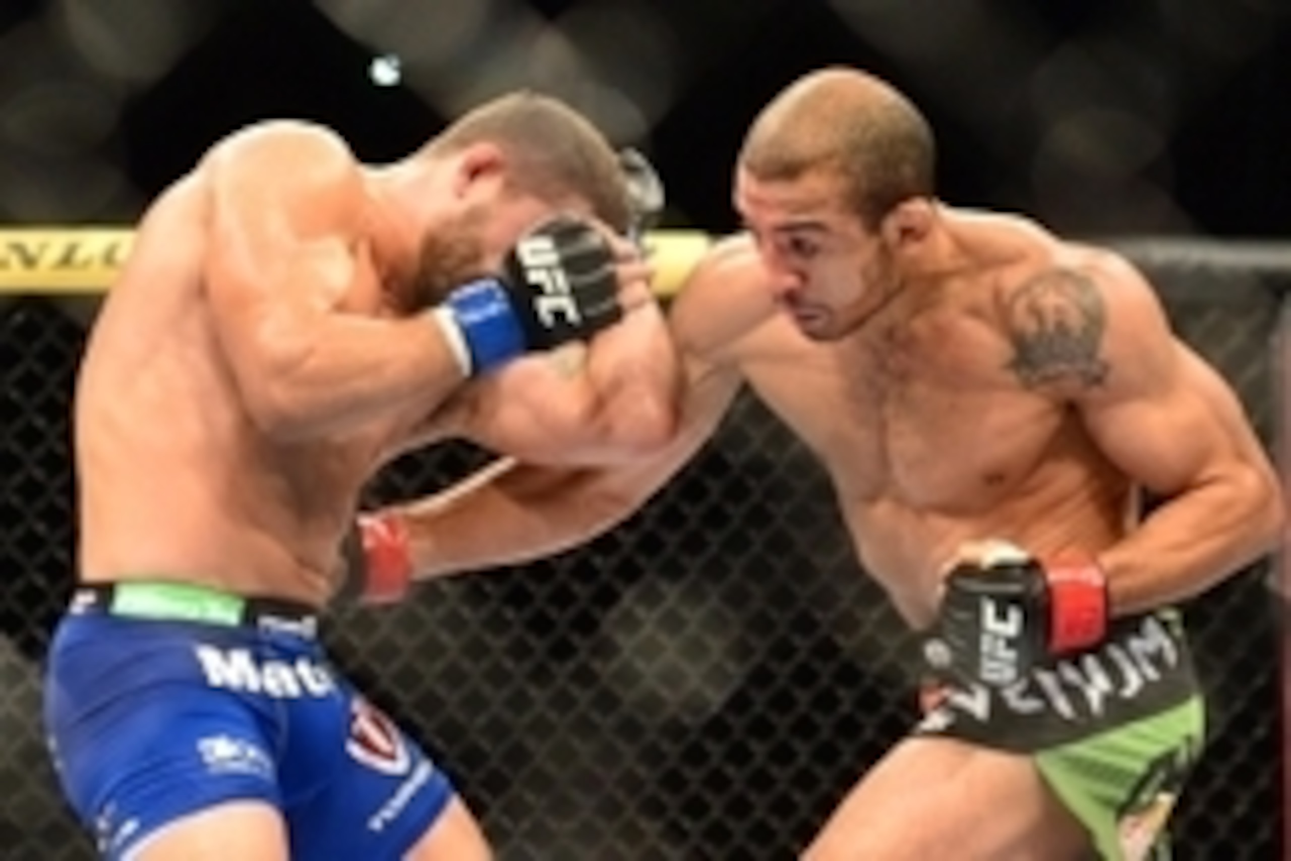 Oct 25, 2014; Rio de Janeiro, Brazil; Jose Aldo (red gloves) fights against Chad Mendez (blue gloves) during UFC 179 at Ginasio do Maracanazinho. Mandatory Credit: Jason Silva-USA TODAY Sports