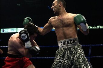 LONDON - May 18:  Prince Naseem Hamed (R) wins the IBO world featherweight title against Manuel Calvo at the London Arena in England on May 18, 2002. DIGITAL IMAGE (Photo by John Gichigi/Getty Images)