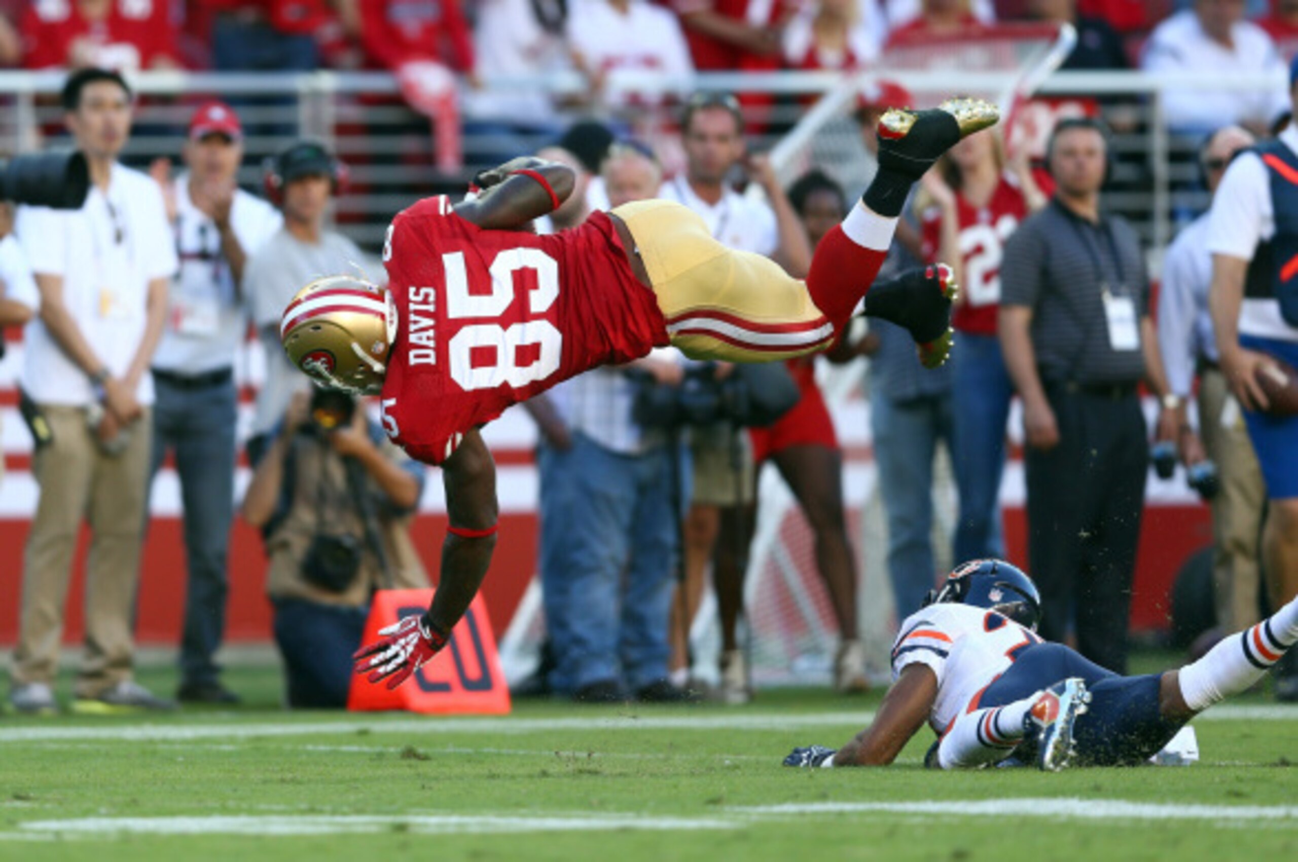 SANTA CLARA, CA - SEPTEMBER 14: Tight end Vernon Davis #85 of the San Francisco 49ers gets hit by cornerback Kyle Fuller #23 of the Chicago Bears during the second quarter of their game at Levi's Stadium on September 14, 2014 in Santa Clara, California. (