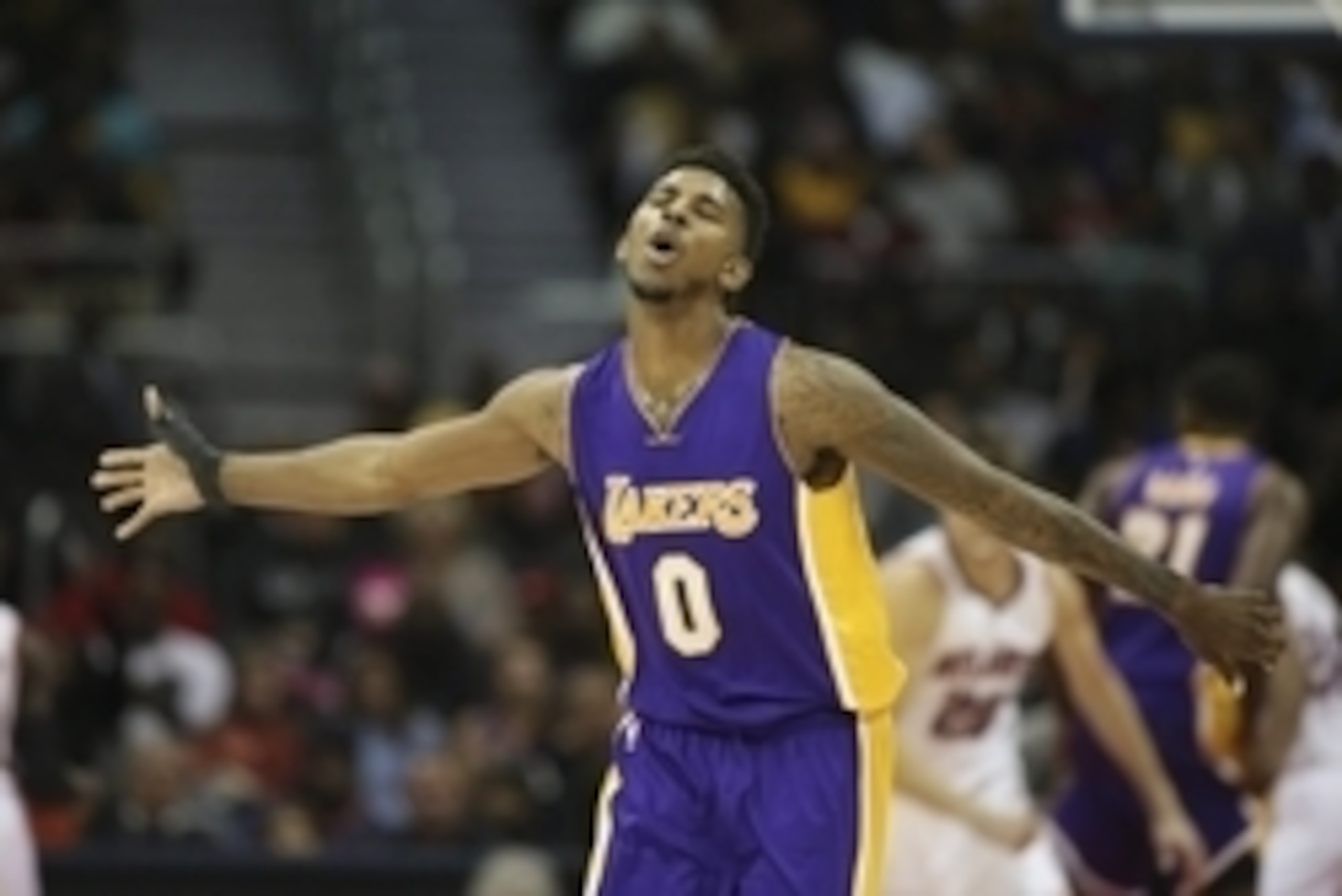Nov 18, 2014; Atlanta, GA, USA; Los Angeles Lakers forward Nick Young (0) reacts after making a basket in the fourth quarter of their game against the Atlanta Hawks at Philips Arena. The Lakers won 114-109. Mandatory Credit: Jason Getz-USA TODAY Sports
