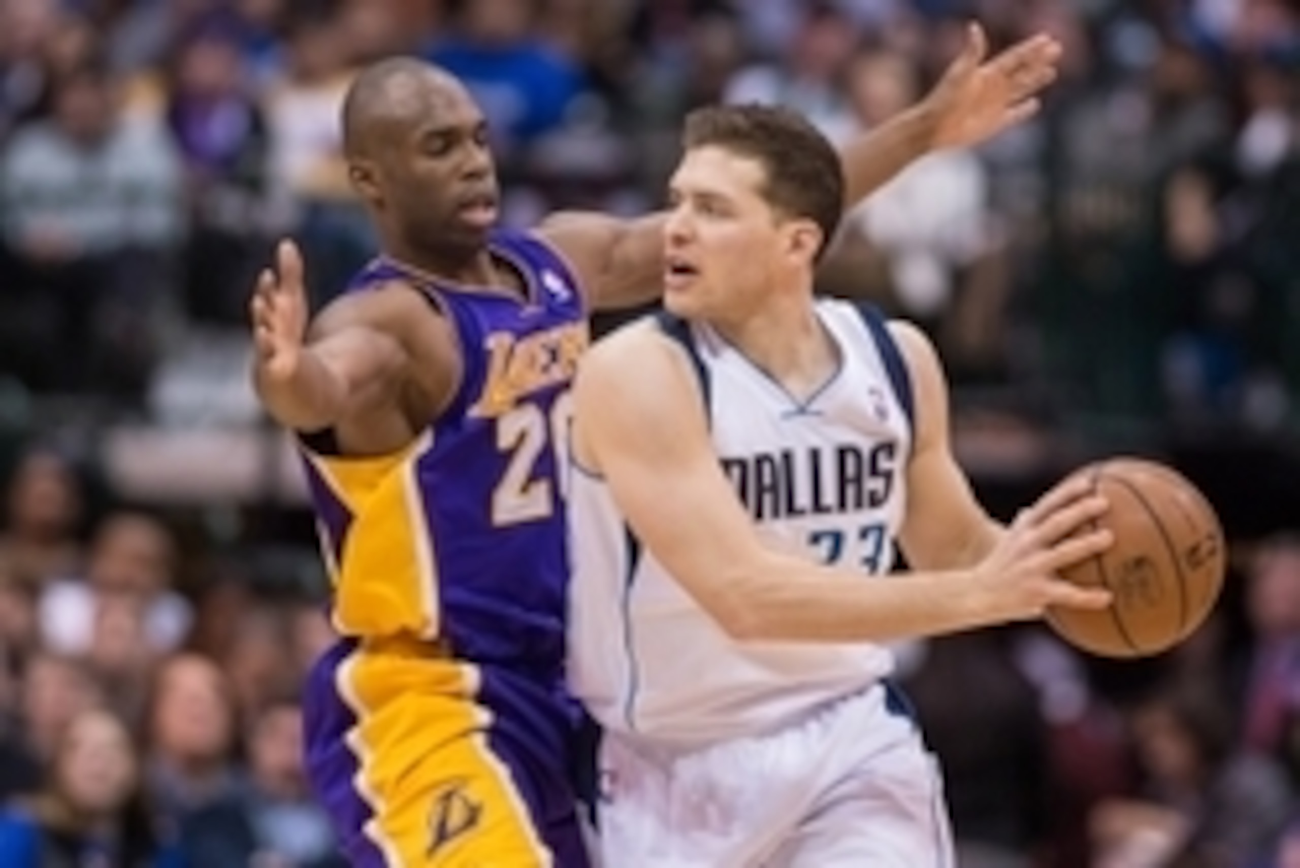 Jan 7, 2014; Dallas, TX, USA; Los Angeles Lakers shooting guard Jodie Meeks (20) defends Dallas Mavericks point guard Gal Mekel (33) during the second half at the American Airlines Center. The Mavericks won 110-97. Meeks leads his team with 24 points. Man