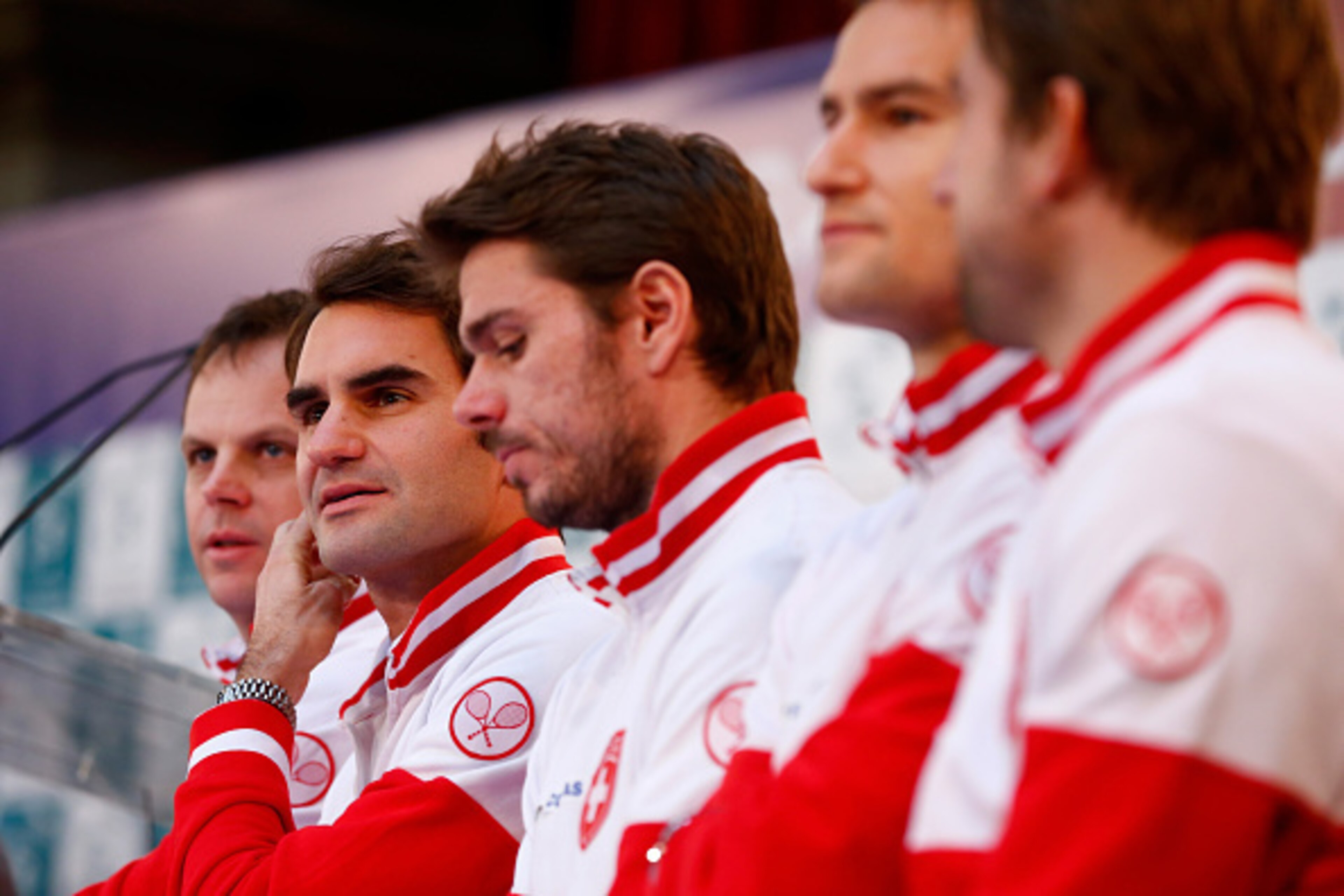 LILLE, FRANCE - NOVEMBER 20:  Roger Federer of Switzerland looks on next to Stanislas Wawrinka of Switzerland at the draw during previews for the Davis Cup Tennis Final between France and Switzerland at the Place du Theatre on November 20, 2014 in Lille, 