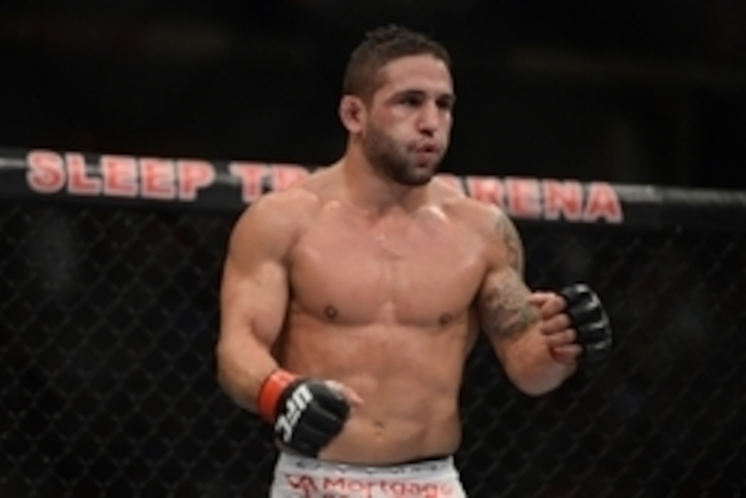December 14, 2013; Sacramento, CA, USA; Chad Mendes (red gloves) fights Nik Lentz (blue gloves) during the featherweight bout of the UFC on FOX 9 at Sleep Train Arena. Mendes defeated Lentz. Mandatory Credit: Kyle Terada-USA TODAY Sports