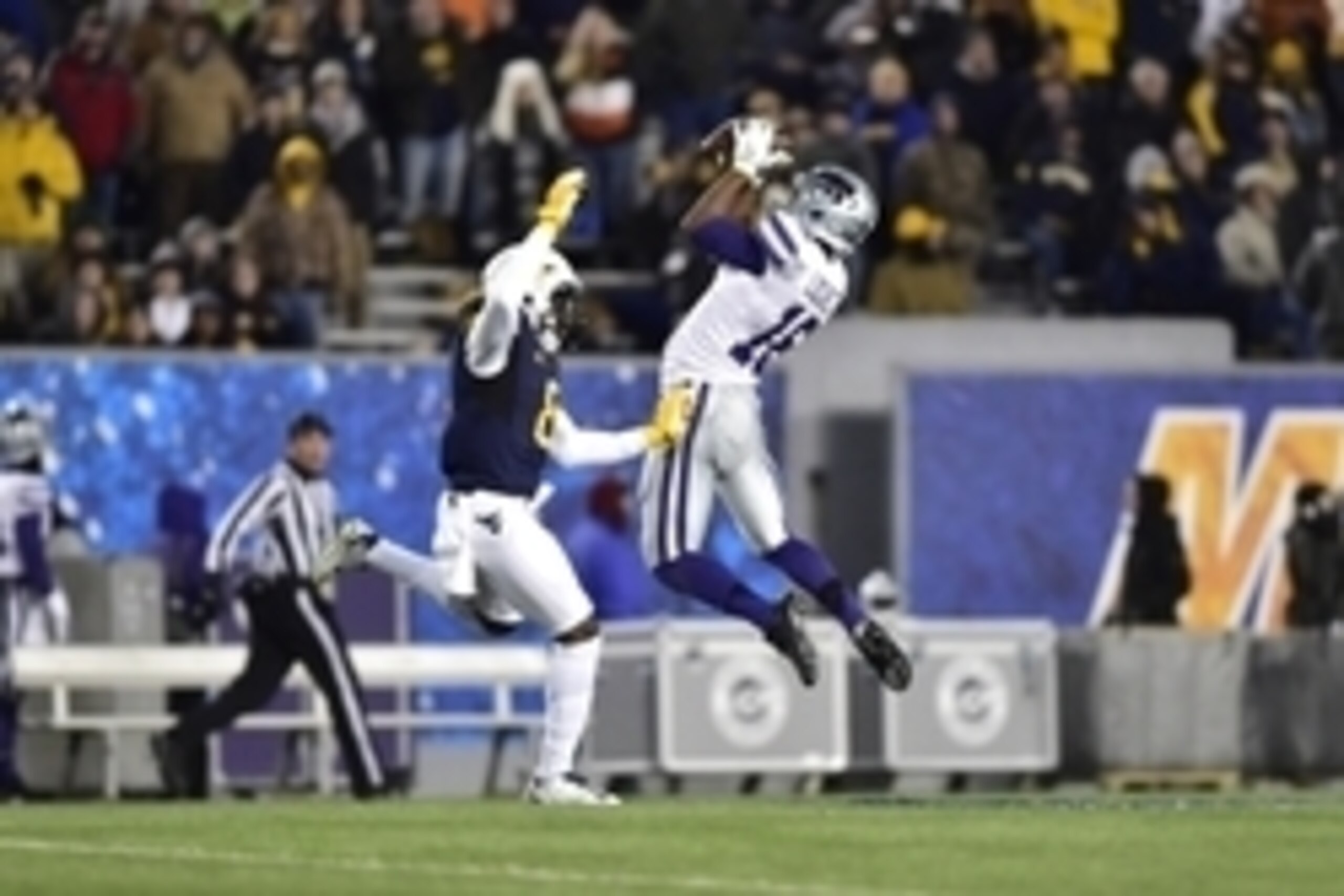 Nov 20, 2014; Morgantown, WV, USA; Kansas State Wildcats wide receiver Tyler Lockett (16) catches the ball as West Virginia Mountaineers safety Karl Joseph (8) defends in the second quarter at Milan Puskar Stadium. Mandatory Credit: Bob Donnan-USA TODAY S