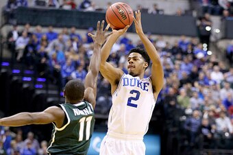 INDIANAPOLIS, IN - NOVEMBER 18: Quinn Cook #2 of the Duke Blue Devils shoots the ball during the game against the Michigan State Spartans in the State Farm Champions Classic at Bankers Life Fieldhouse on November 18, 2014 in Indianapolis, Indiana.  (Photo