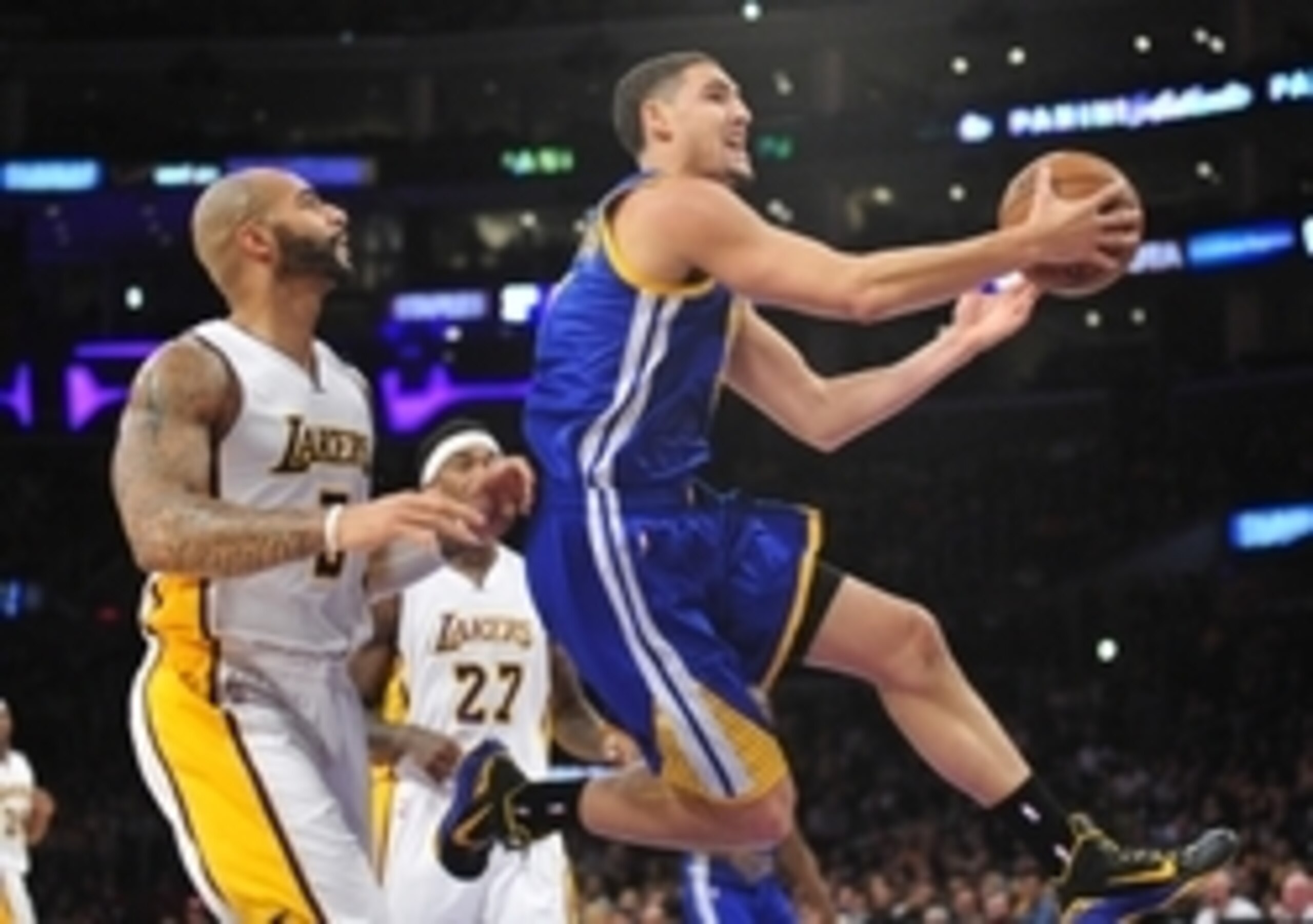 November 16, 2014; Los Angeles, CA, USA; Golden State Warriors guard Klay Thompson (11) moves to the basket ahead of Los Angeles Lakers forward Carlos Boozer (5) during the first half at Staples Center. Mandatory Credit: Gary A. Vasquez-USA TODAY Sports November 16, 2014; Los Angeles, CA, USA; Golden State Warriors guard Klay Thompson (11) moves to the basket ahead of Los Angeles Lakers forward Carlos Boozer (5) during the first half at Staples Center. Mandatory Credit: Gary A. Vasquez-USA TODAY Sports