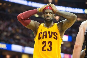 CLEVELAND, OH - NOVEMBER 19: LeBron James #23 of the Cleveland Cavaliers  reacts after being called for a foul during the first half against the San Antonio Spurs at Quicken Loans Arena on November 19, 2014 in Cleveland, Ohio. User expressly acknowledges 