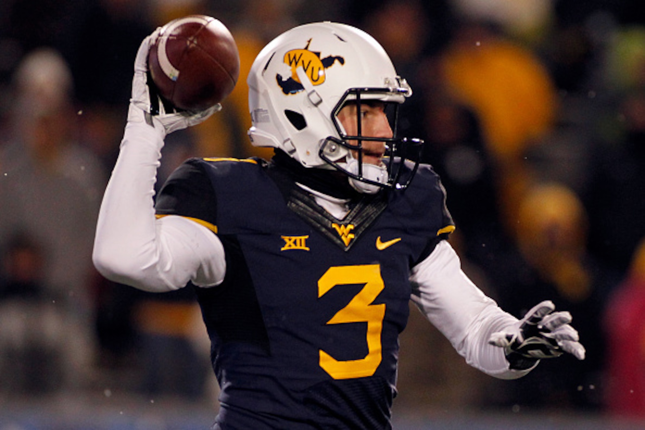 MORGANTOWN, WV - NOVEMBER 20:  Skyler Howard #3 of the West Virginia Mountaineers drops back to pass in the fourth quarter against the Kansas State Wildcats during the game on November 20, 2014 at Mountaineer Field in Morgantown, West Virginia.  The Kansa