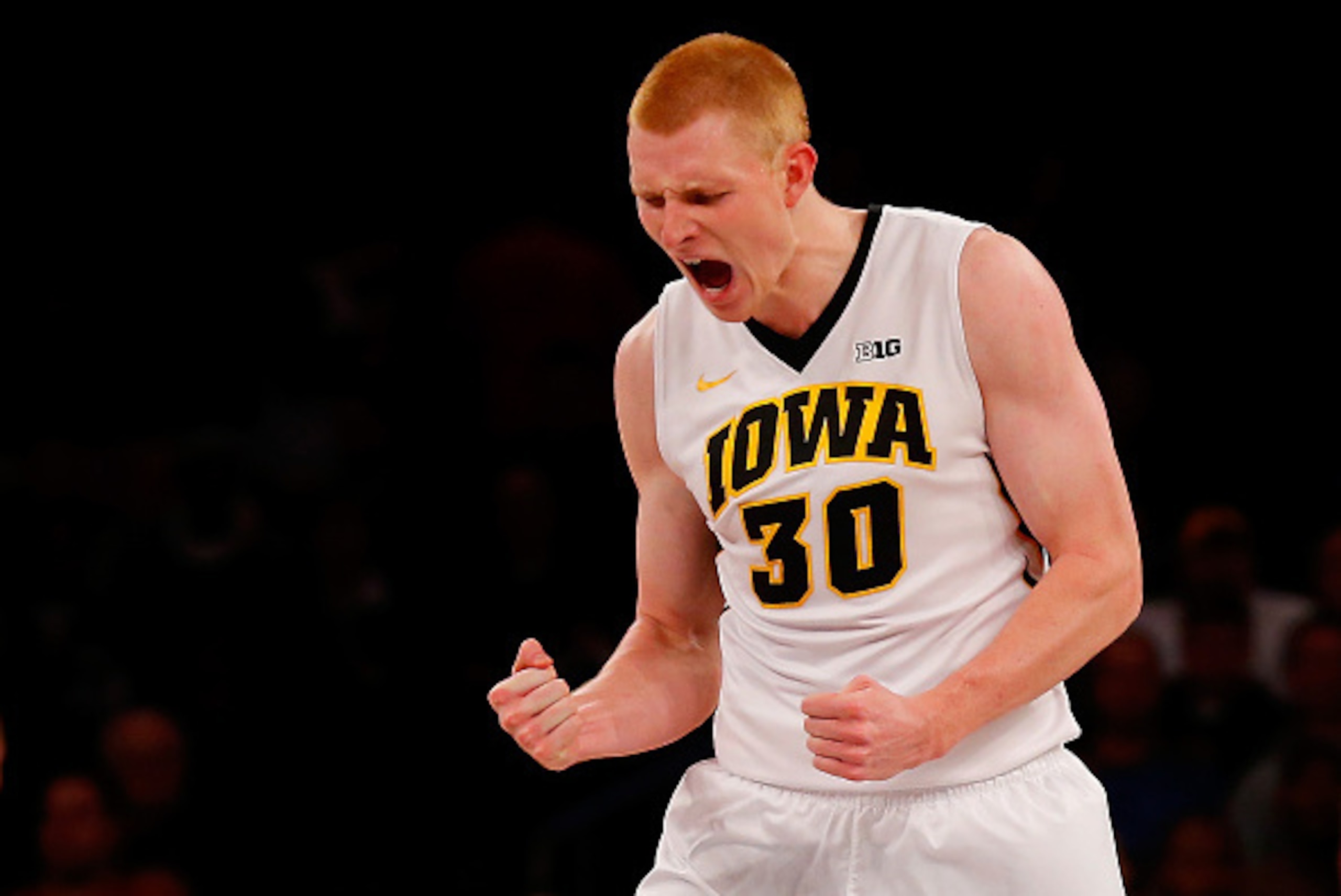NEW YORK, NY - NOVEMBER 20:  Aaron White #30 of the Iowa Hawkeyes reacts after scoring against the Texas Longhorns during the 2K Classic at Madison Square Garden on November 20, 2014 in New York City.  (Photo by Mike Stobe/Getty Images)