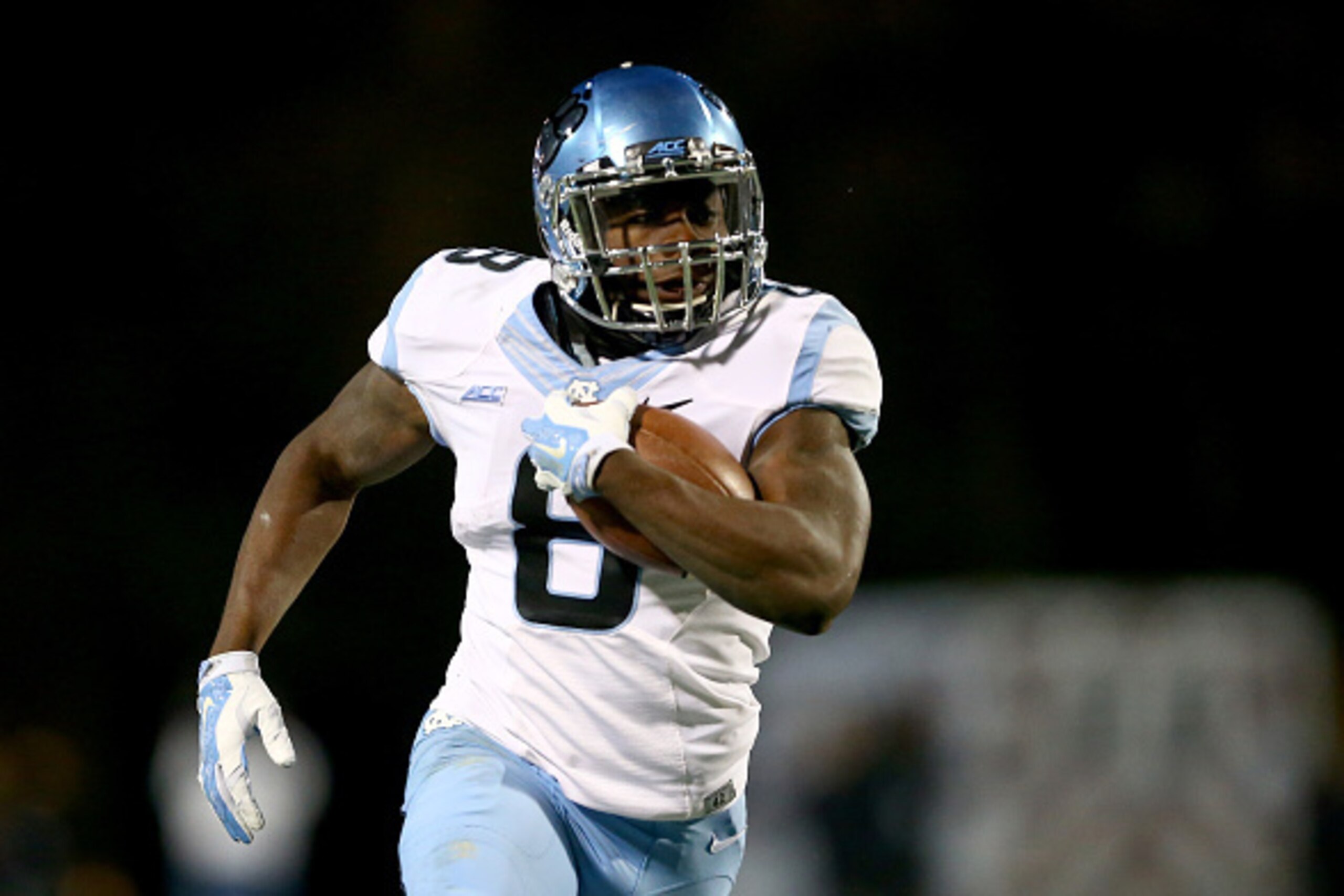 DURHAM, NC - NOVEMBER 20:  T.J. Logan #8 of the North Carolina Tar Heels runs with the ball against the Duke Blue Devils during their game at Wallace Wade Stadium on November 20, 2014 in Durham, North Carolina.  (Photo by Streeter Lecka/Getty Images)