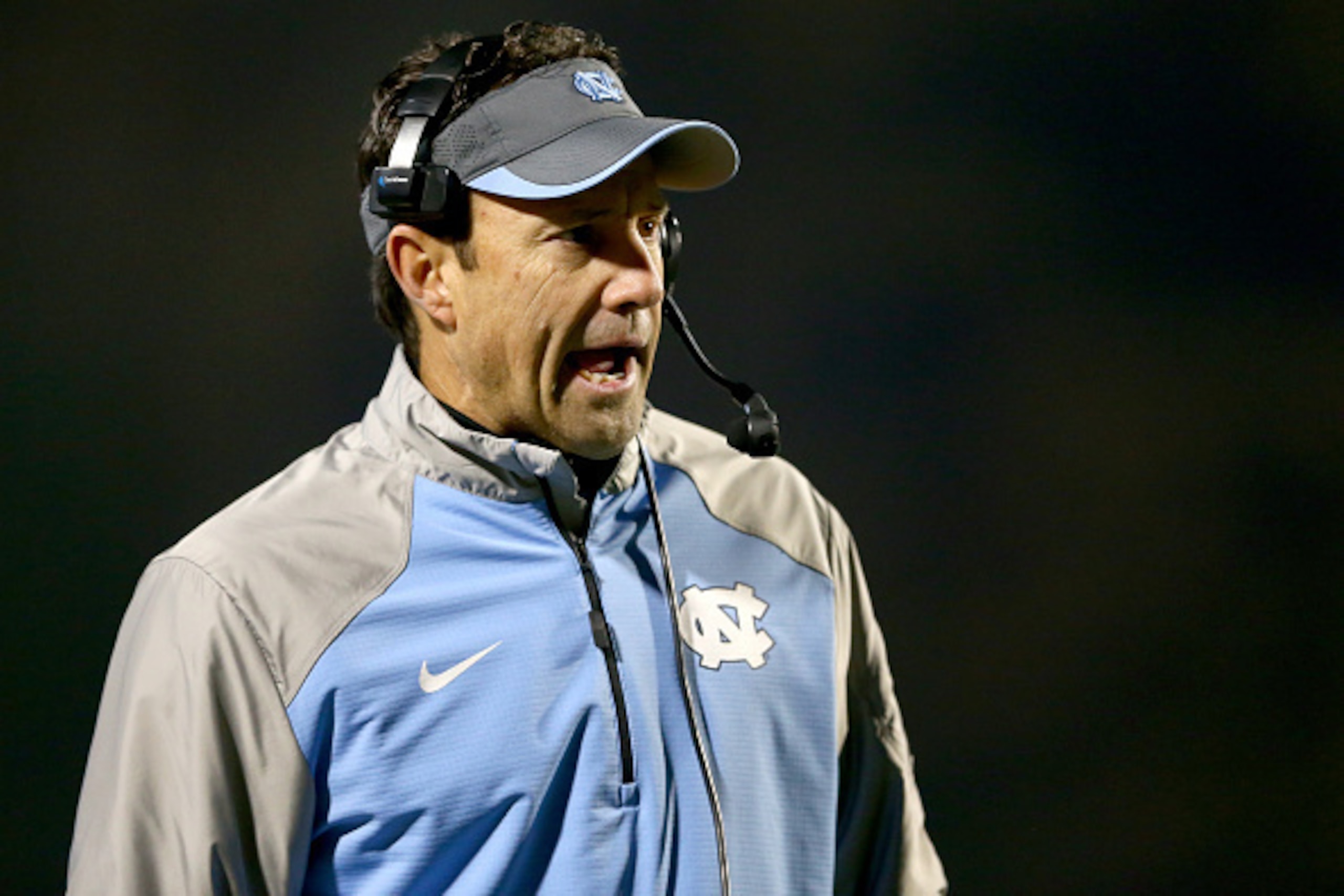 DURHAM, NC - NOVEMBER 20:  Head coach Larry Fedora of the North Carolina Tar Heels watches on during their game against the Duke Blue Devils at Wallace Wade Stadium on November 20, 2014 in Durham, North Carolina.  (Photo by Streeter Lecka/Getty Images)